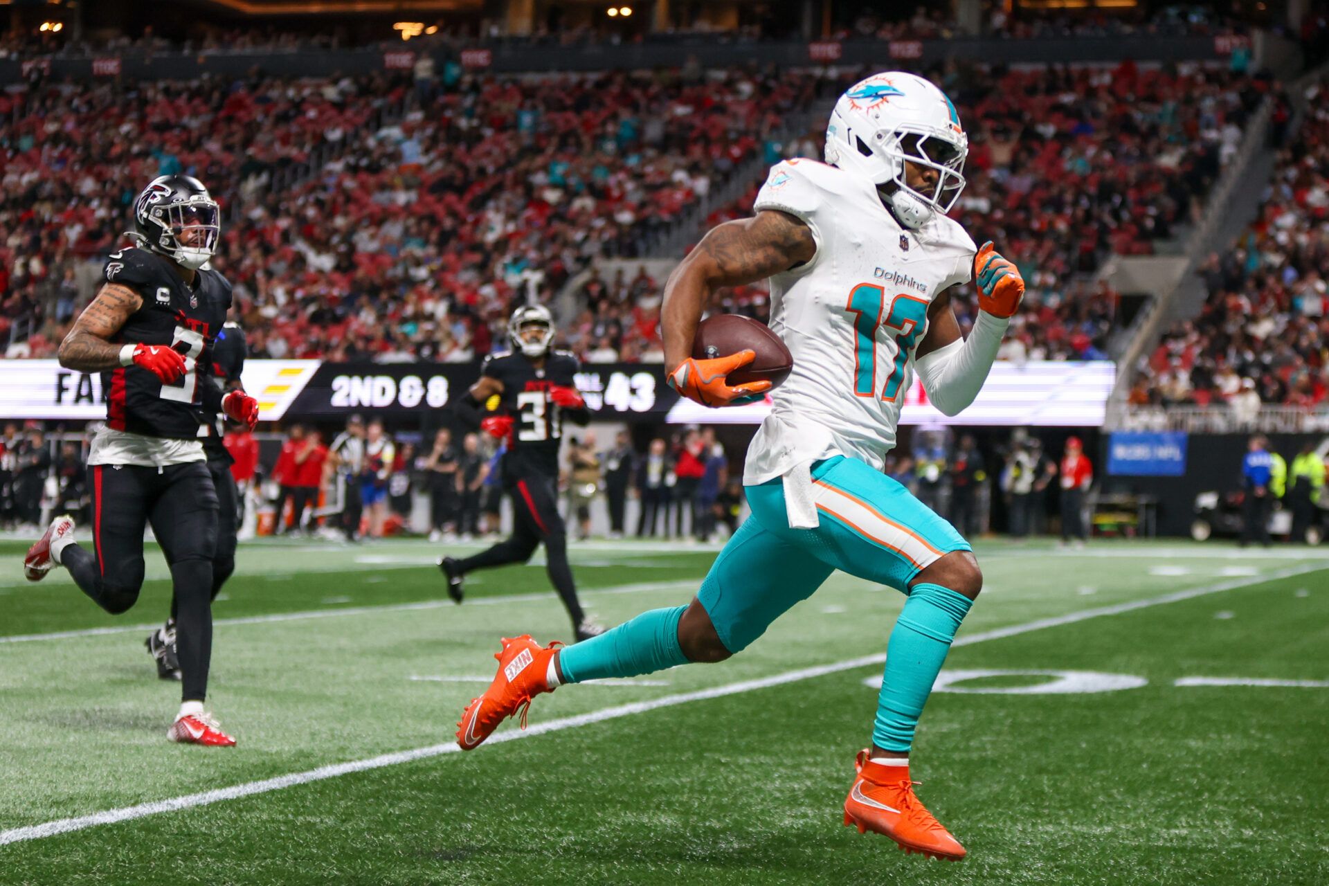 Miami Dolphins wide receiver Jaylen Waddle (17) scores a touchdown against the Atlanta Falcons in the third quarter at Mercedes-Benz Stadium.