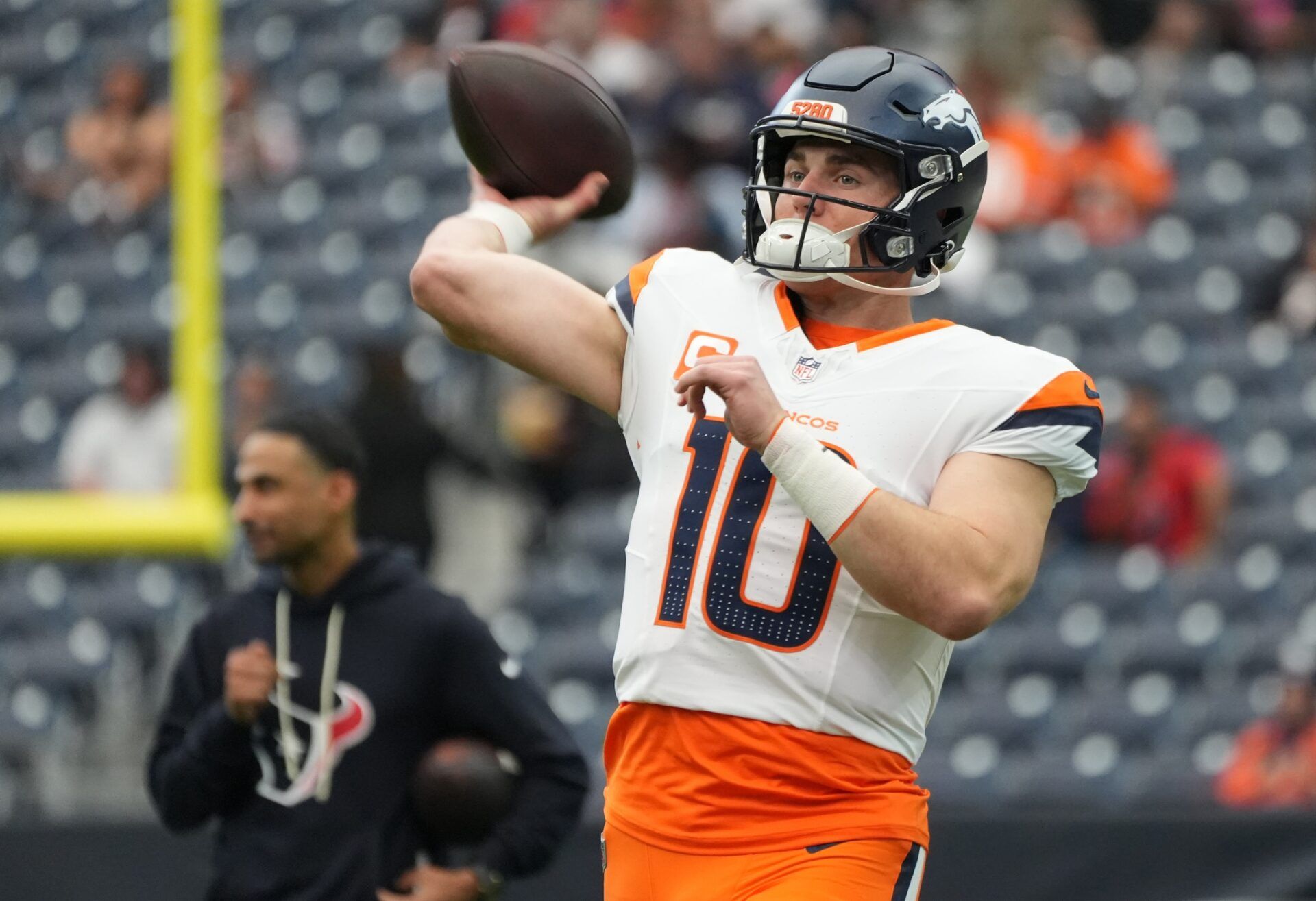 Denver Broncos quarterback Bo Nix (10) warms up before a game against the Houston Texans at NRG Stadium.