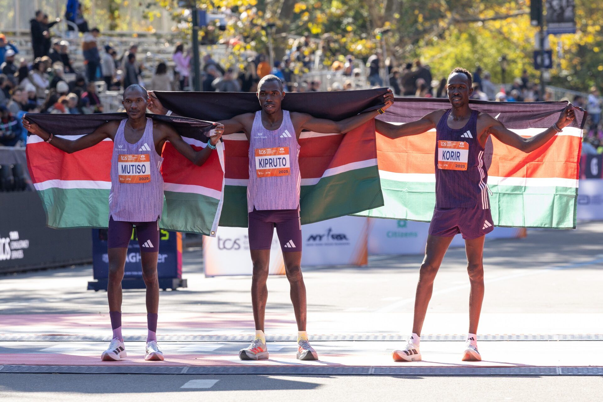 Pro MenÕs Open Division winners of the 2025 New York City Marathon, first place Benson Kipruto of Kenya (center), second place Alexander Mutiso of Kenya (left), and third place Albert Korir of Kenya (right).