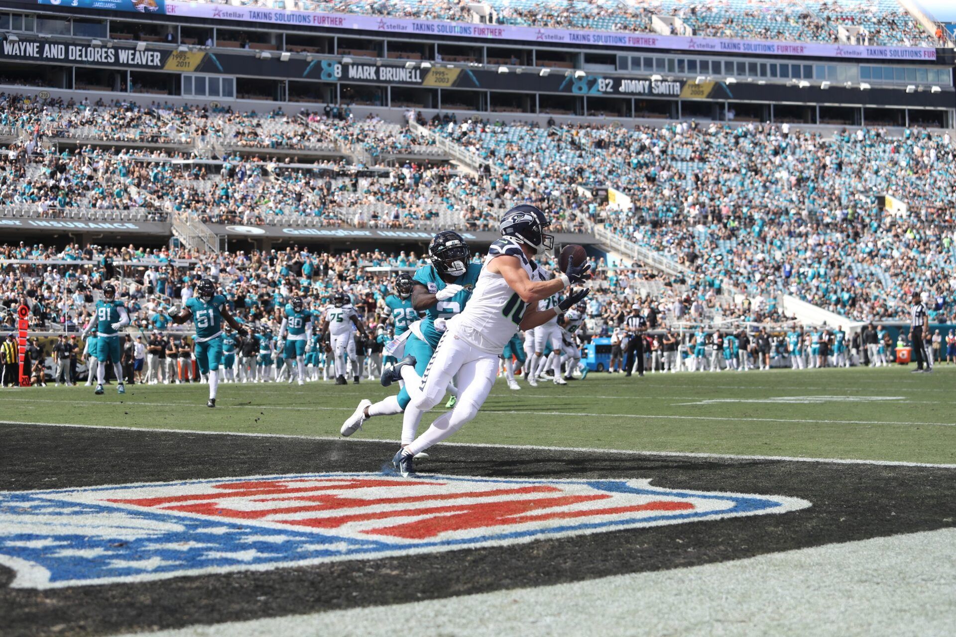 Seattle Seahawks wide receiver Cooper Kupp (10) scores a touchdown during the second half against Jacksonville Jaguars cornerback Jourdan Lewis (2) at EverBank Stadium.