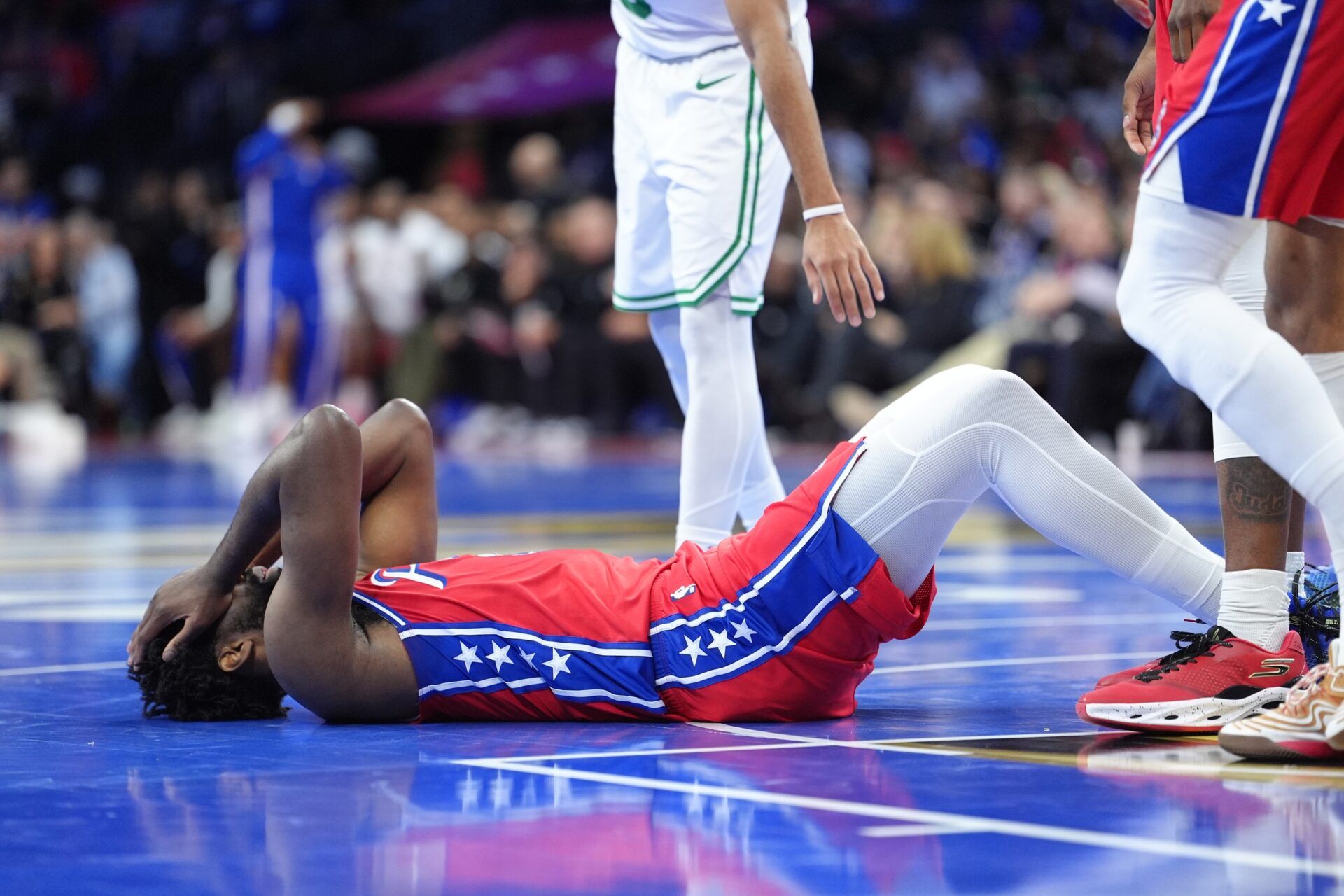 Philadelphia 76ers center Joel Embiid (21) reacts against the Boston Celtics in the third quarter at Xfinity Mobile Arena.