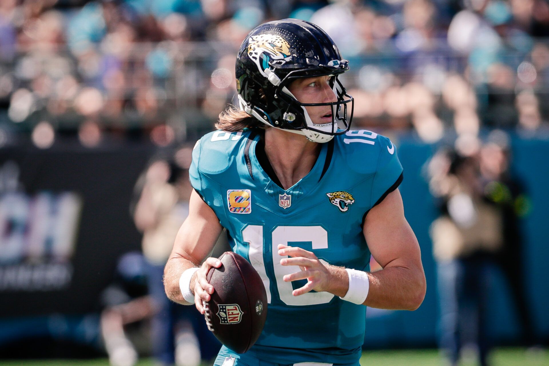Jacksonville Jaguars quarterback Trevor Lawrence (16) drops back to pass against the Seattle Seahawks at EverBank Stadium.