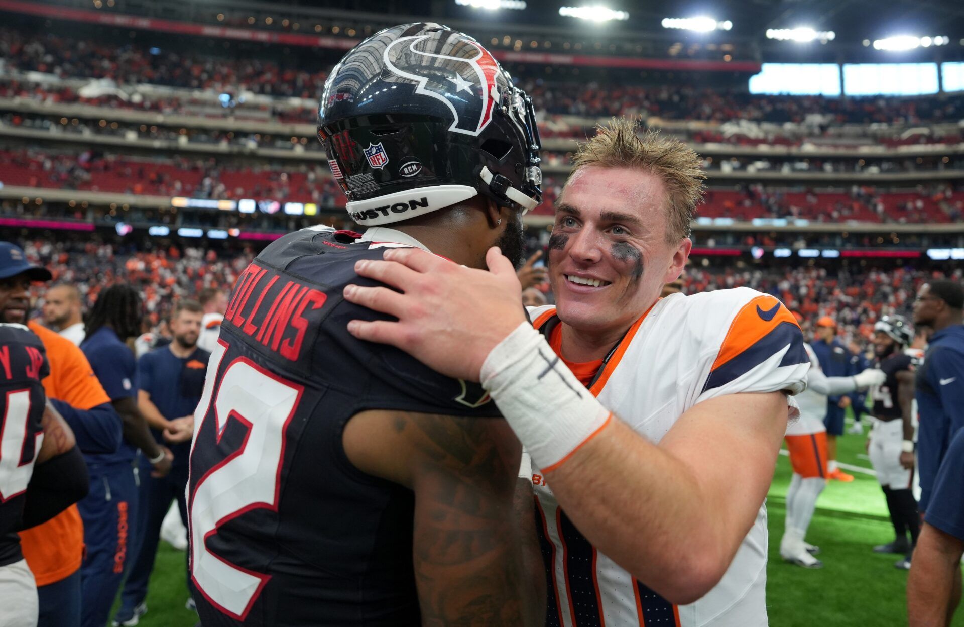 Houston Texans wide receiver Nico Collins (12) and Denver Broncos quarterback Bo Nix (10) talk after the Broncos defeated the Texans at NRG Stadium.