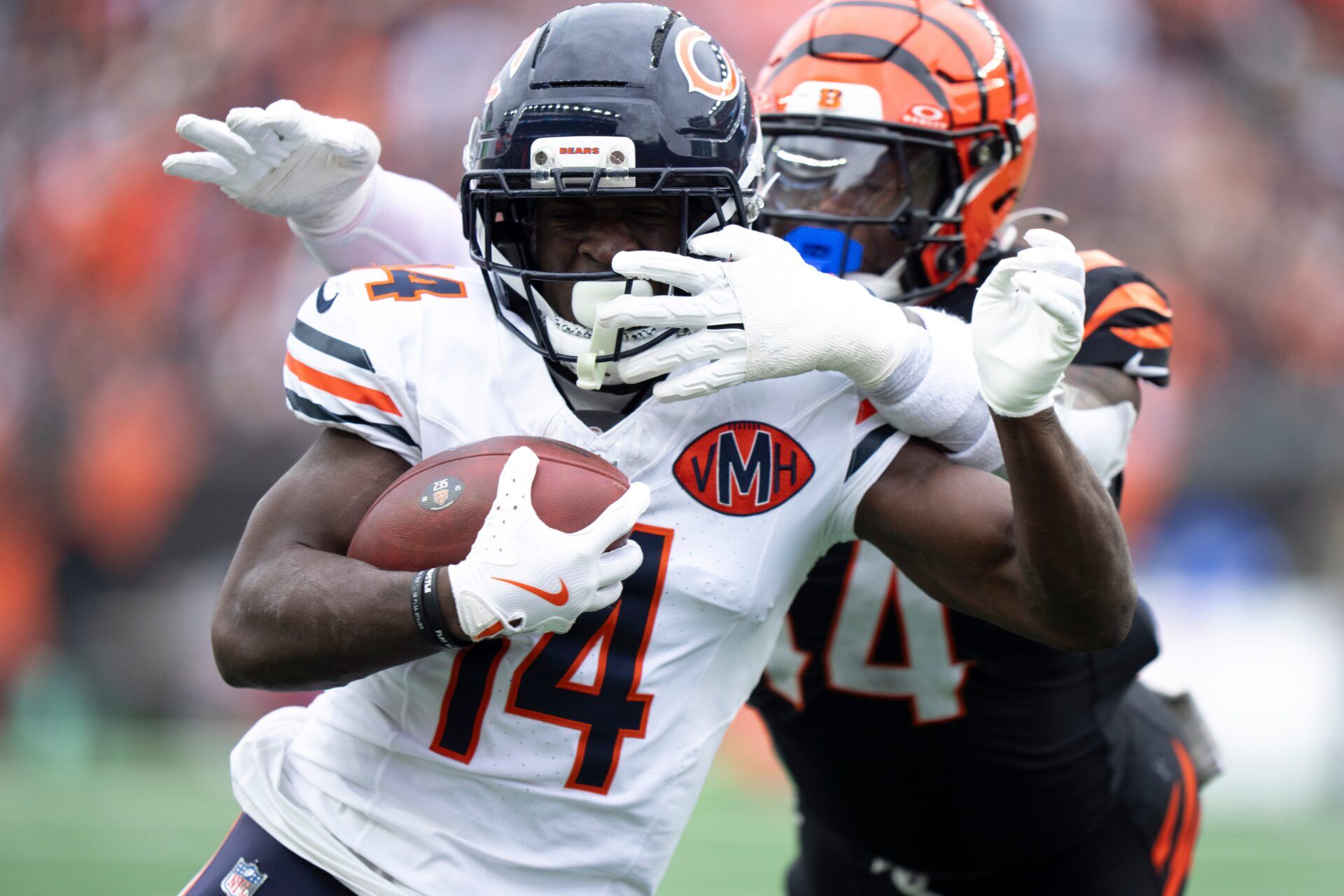 Chicago Bears wide receiver Olamide Zaccheaus (14) scores as Cincinnati Bengals linebacker Demetrius Knight Jr. (44) attempts to stop him in the second quarter of the NFL football game between Chicago Bears and Cincinnati Bengals at Paycor Stadium in Cincinnati on Nov. 2, 2025.
