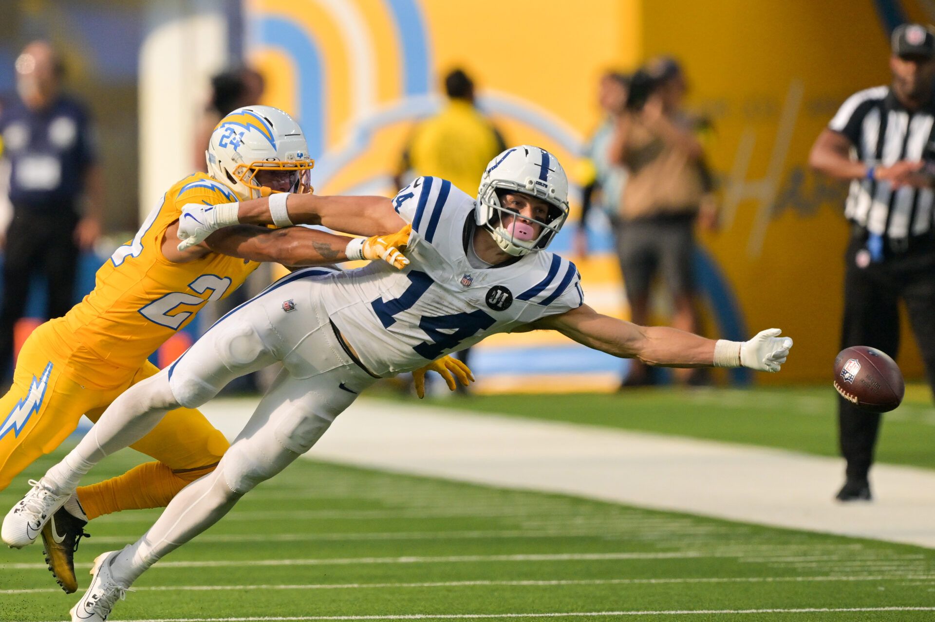 Los Angeles Chargers defensive back Elijah Molden (2) breaks up a pass for Indianapolis Colts wide receiver Alec Pierce (14) in the second half at SoFi Stadium.