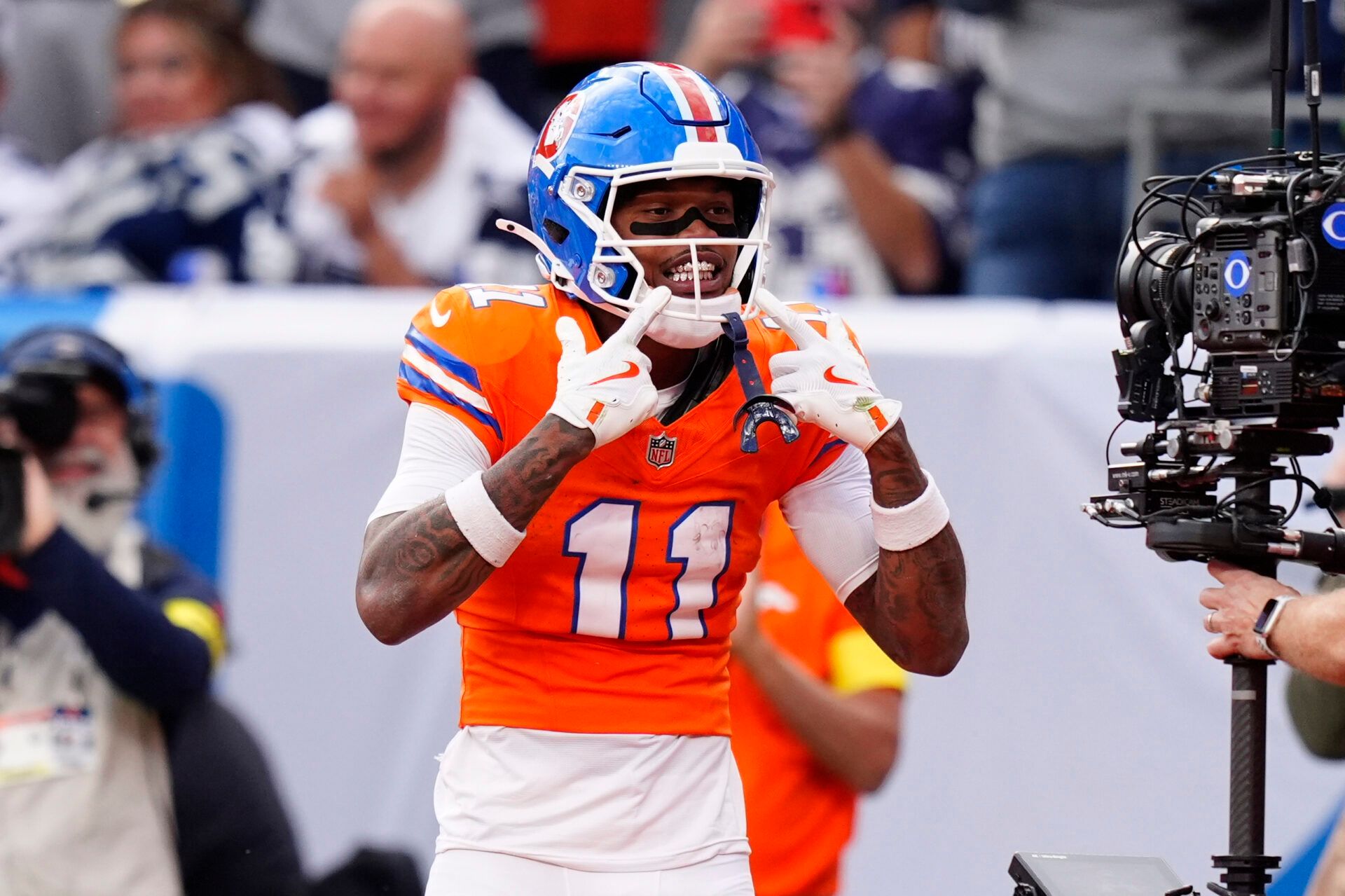 Denver Broncos wide receiver Troy Franklin (11) celebrates after scoring a touchdown against the Dallas Cowboys in the fourth quarter at Empower Field at Mile High.