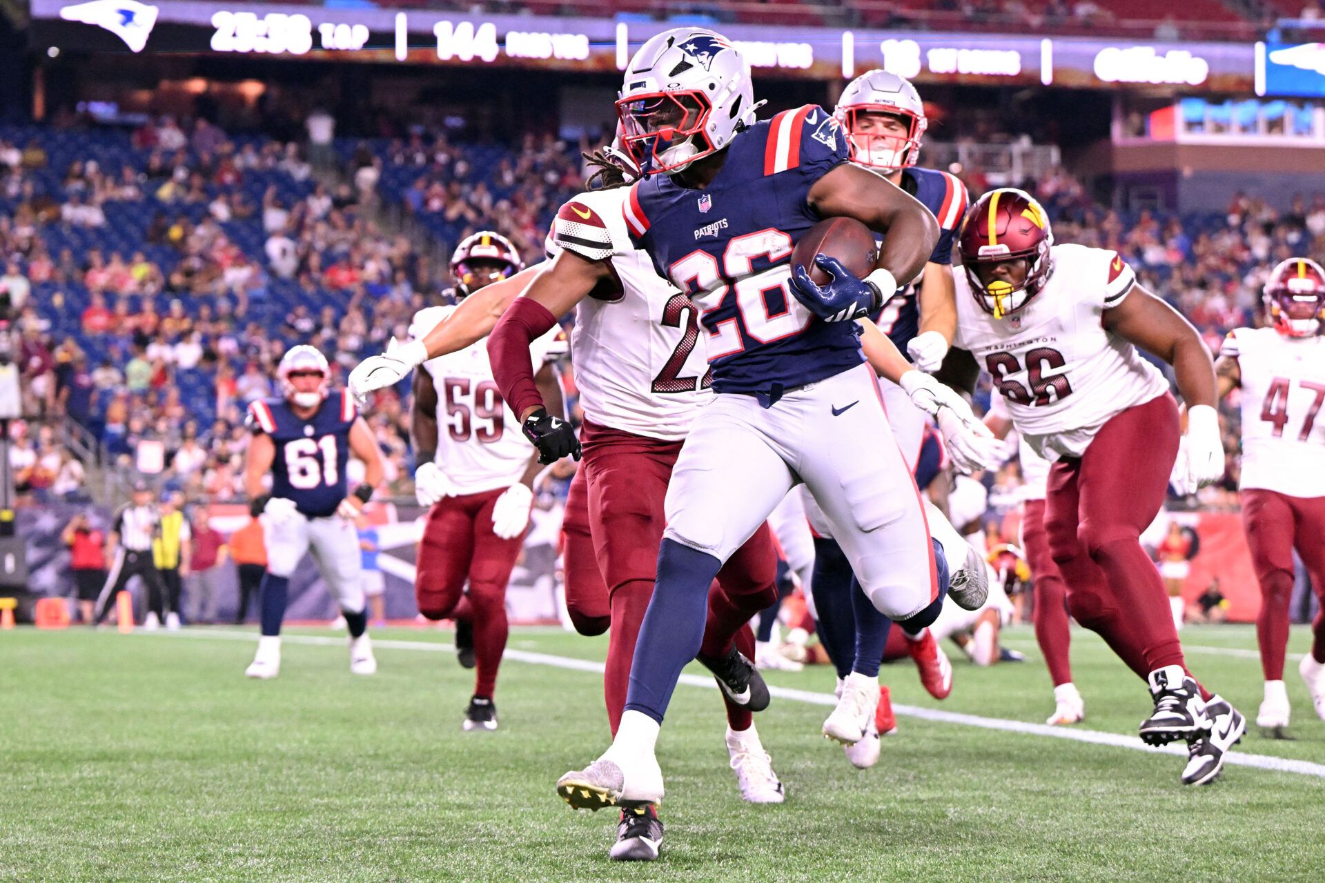 New England Patriots running back Terrell Jennings (26) scores a touchdown against the Washington Commanders during the second half at Gillette Stadium.