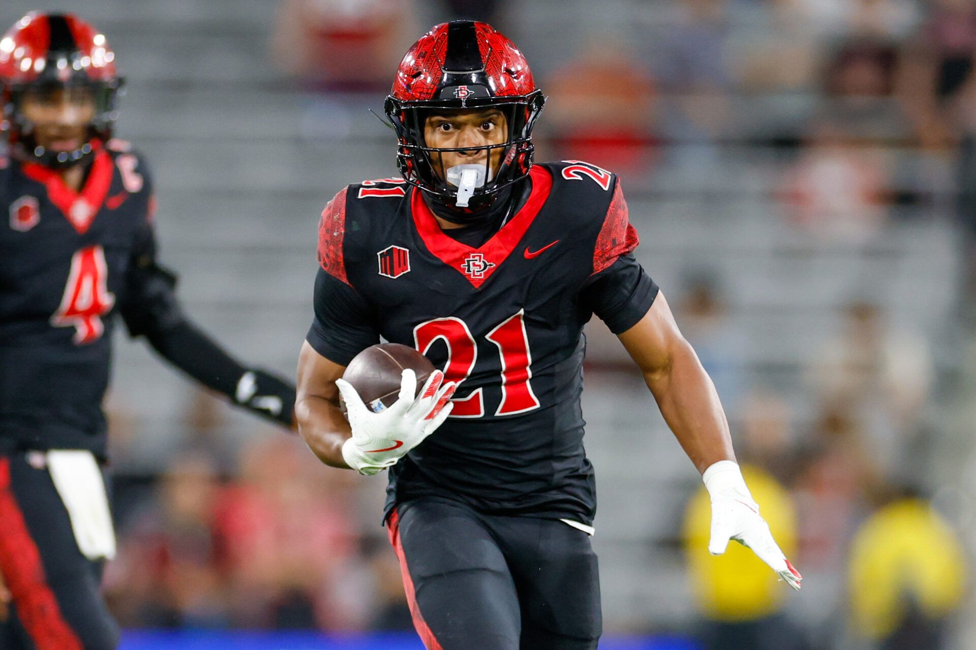 San Diego State Aztecs running back Byron Cardwell Jr. (21) runs the ball during the second half against the Colorado State Rams at Snapdragon Stadium.
