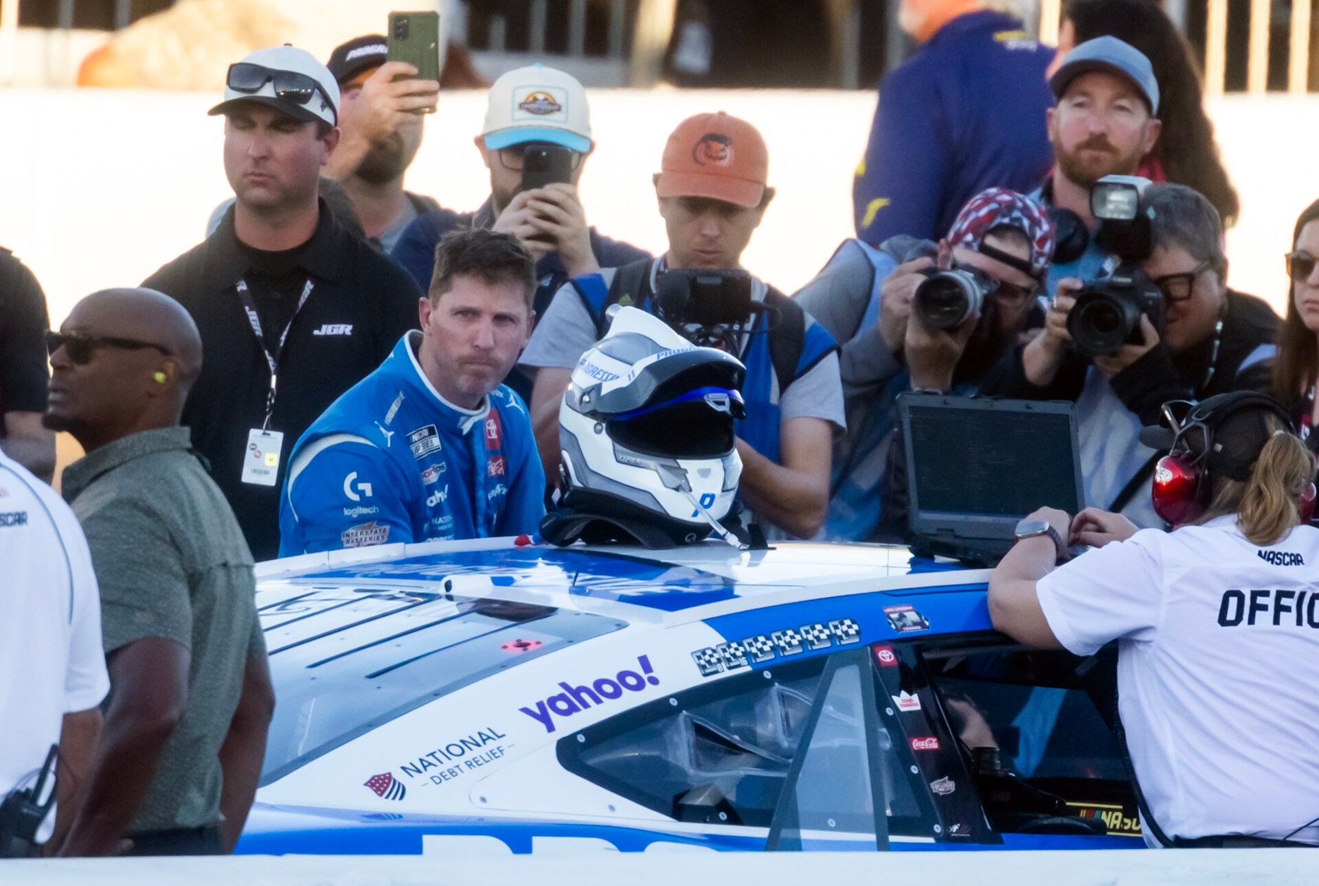 NASCAR Cup Series driver Denny Hamlin (11) reacts after climnbing out of his car following the NASCAR Championship race at Phoenix Raceway.