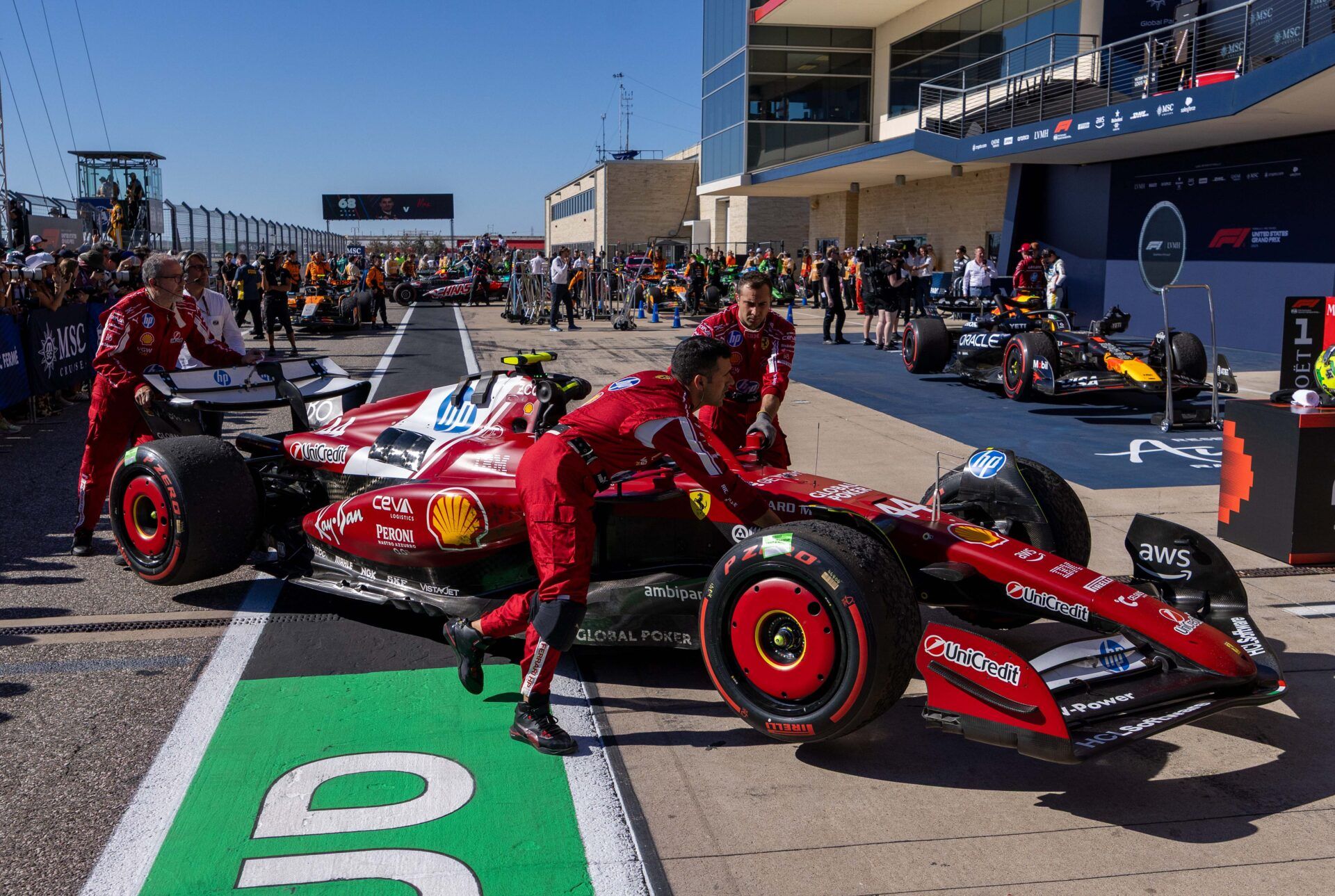 Scuderia Ferrari HP driver Lewis Hamilton (44) of Team Great Britain pushes his car into the garage after the race at Circuit of The Americas Austin.