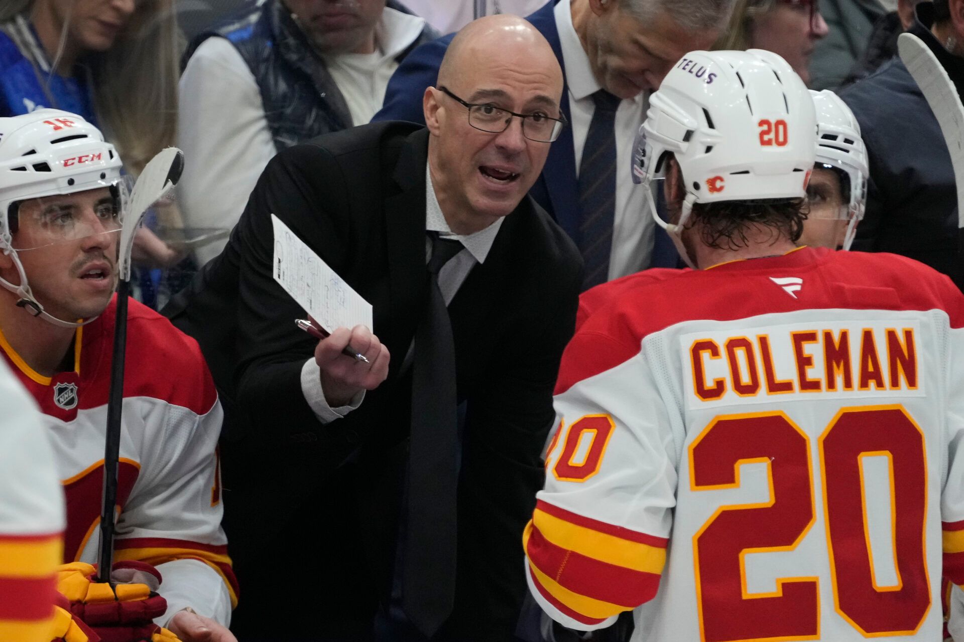 Calgary Flames head coach Ryan Huska talks to forward Blake Coleman (20) during a break in the action against the Toronto Maple Leafs during the third period at Scotiabank Arena.