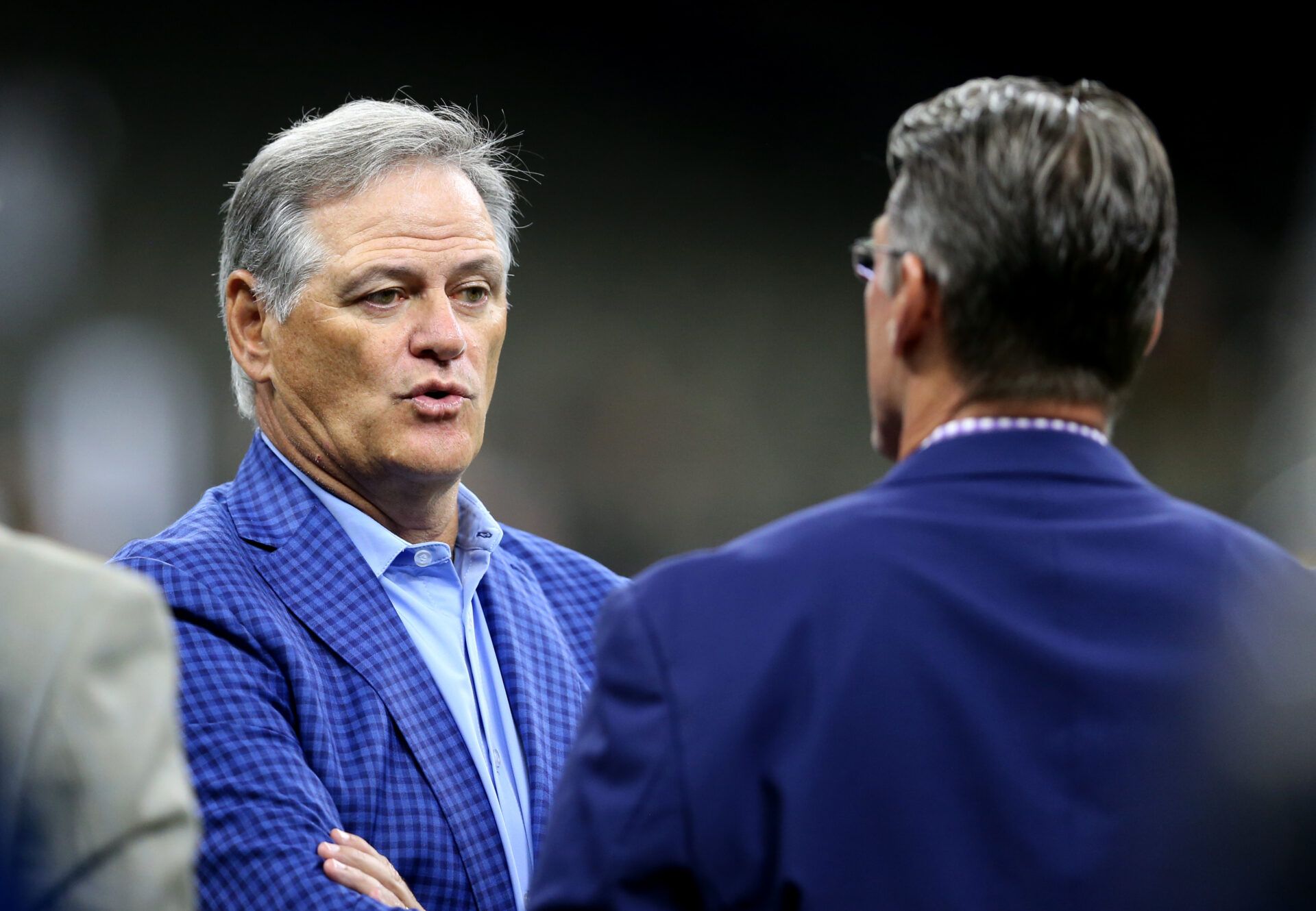 New Orleans Saints general manager Mickey Loomis (left) talks with Minnesota Vikings general manager Rick Spielman before the game against the Minnesota Vikings at the Mercedes-Benz Superdome.
