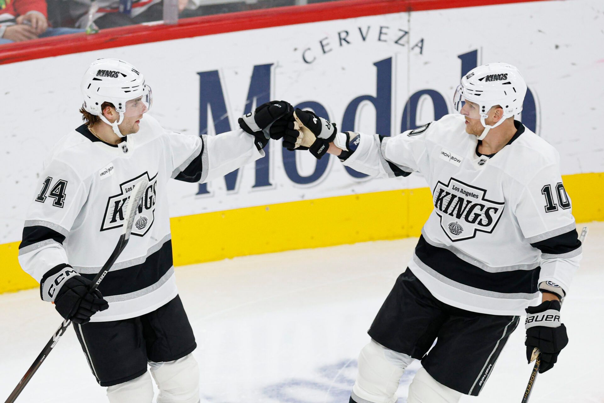 Los Angeles Kings right wing Alex Laferriere (14) celebrates with right wing Corey Perry (10) after scoring against the Chicago Blackhawks during the second period at United Center.
