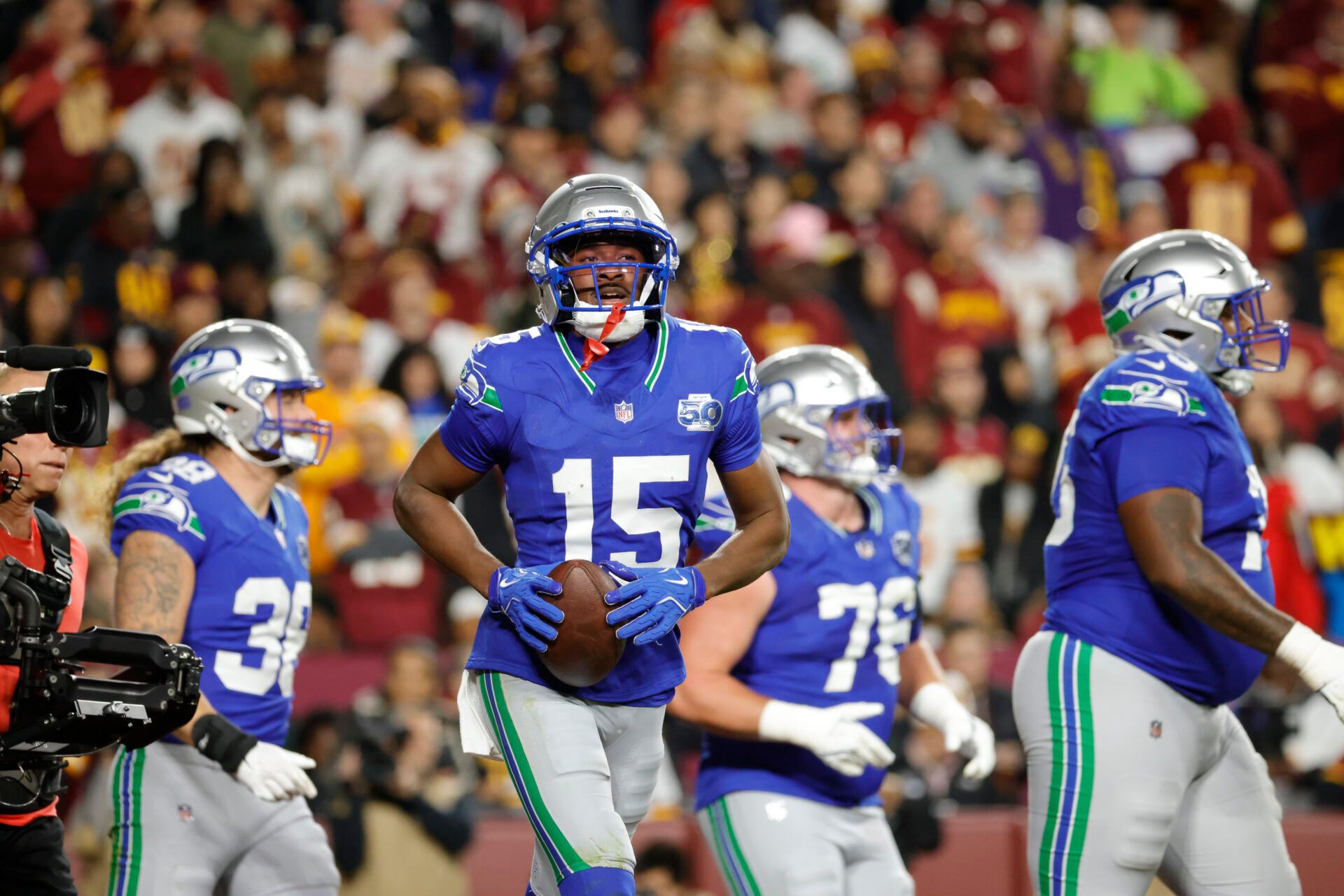Seattle Seahawks wide receiver Tory Horton (15) celebrates a touchdown  against the Washington Commanders during the first half at Northwest Stadium.