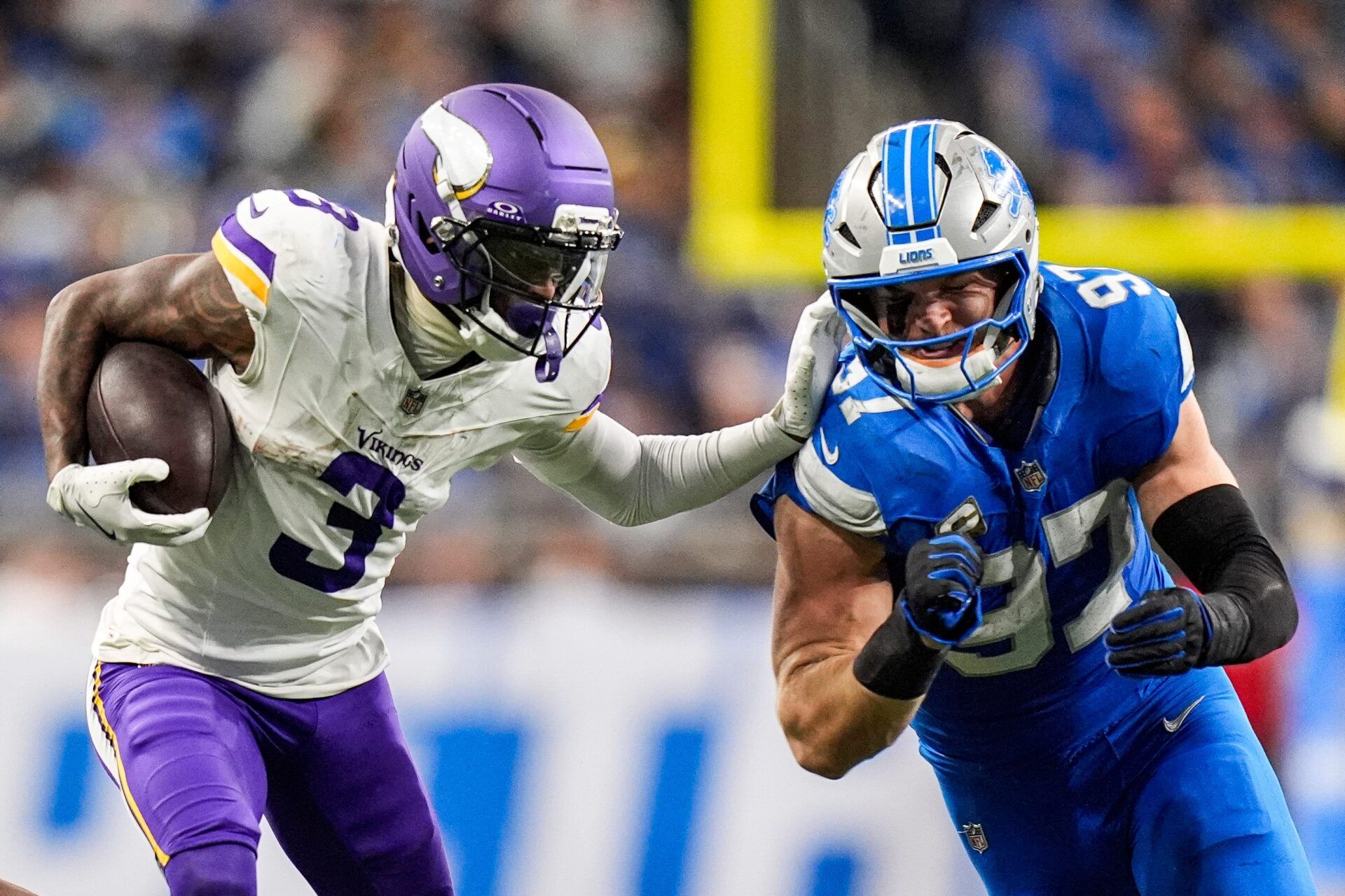 Detroit Lions defensive end Aidan Hutchinson (97) tackles Minnesota Vikings wide receiver Jordan Addison (3) during the second half at Ford Field in Detroit on Sunday, November 2, 2025.