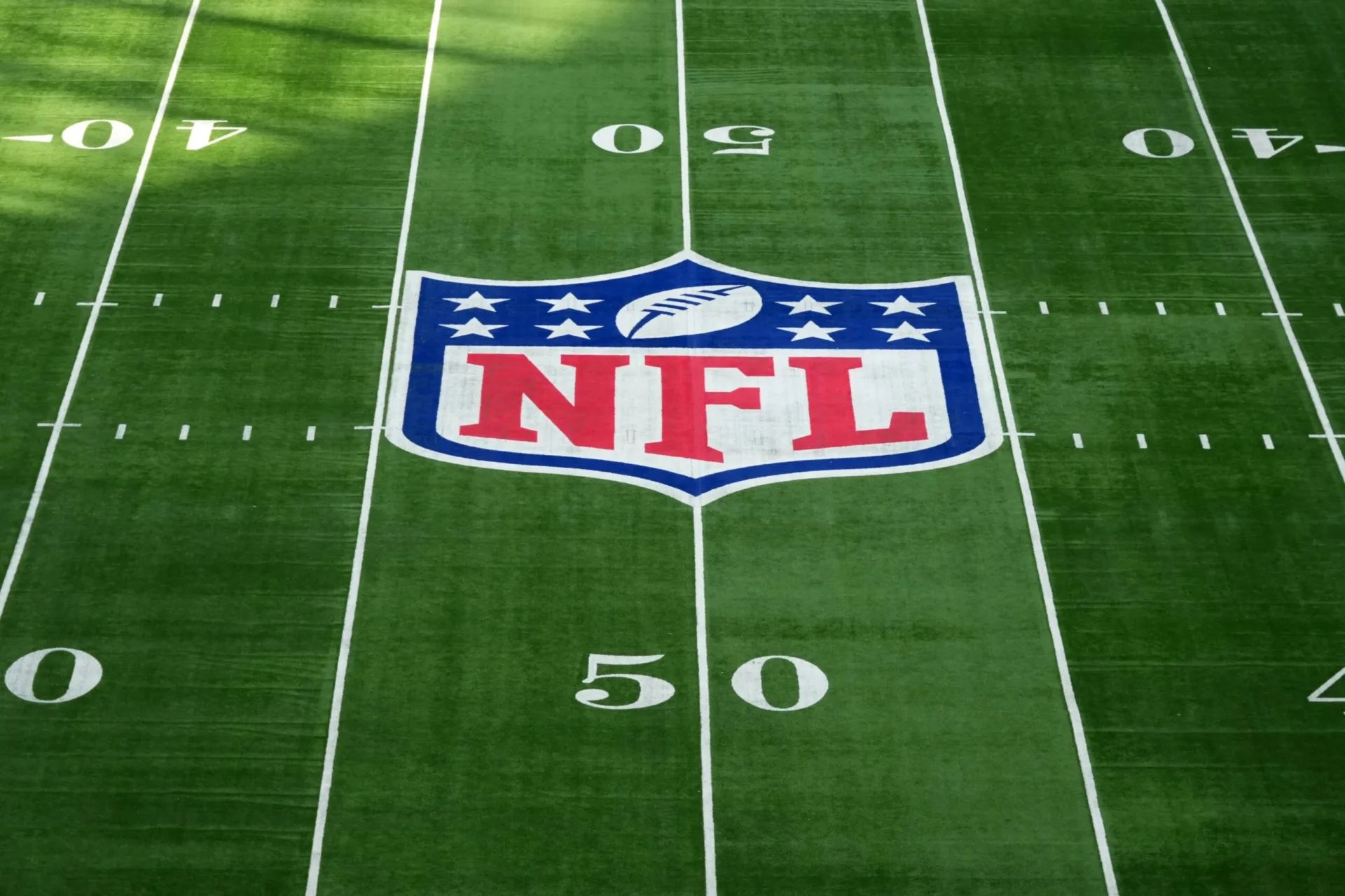 The NFL shield logo a midfield during an NFL International Series game at Tottenham Hotspur Stadium.
