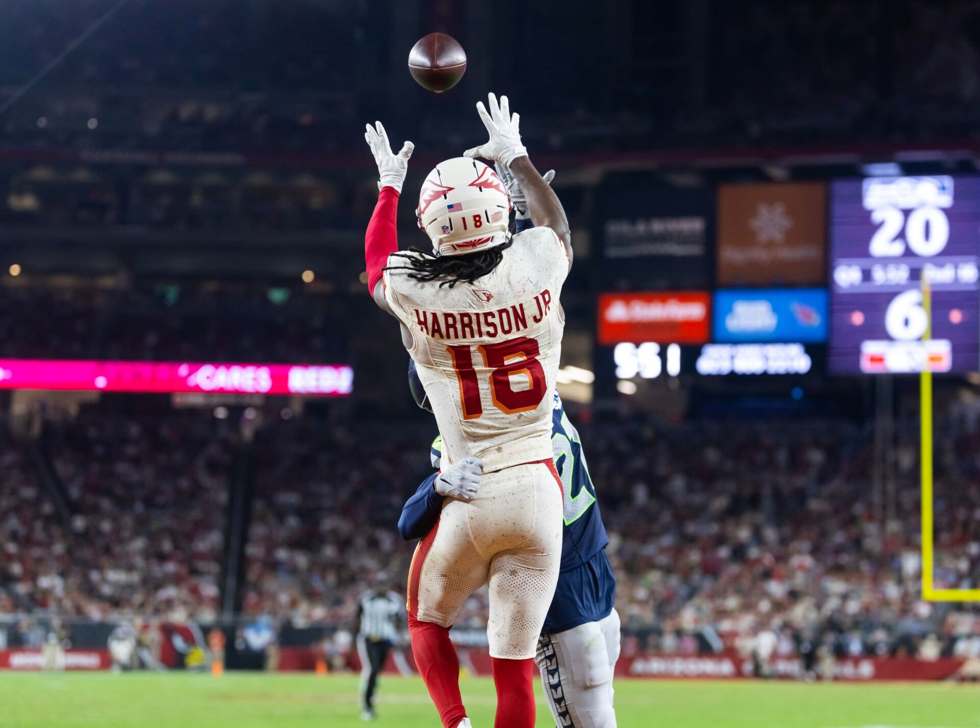 Arizona Cardinals wide receiver Marvin Harrison Jr. (18) catches a pass for a touchdown against the Seattle Seahawks at State Farm Stadium.