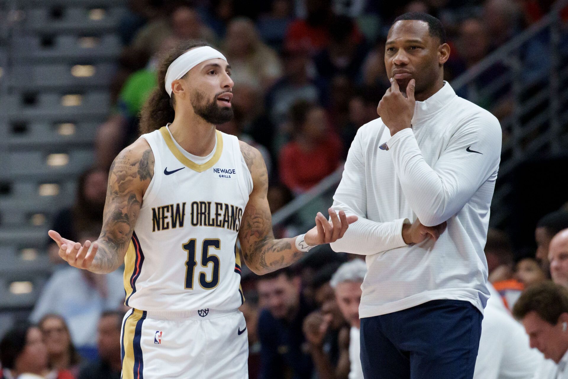 New Orleans Pelicans guard Jose Alvarado (15) talks with head coach Willie Green during the second half against the Boston Celtics at Smoothie King Center.