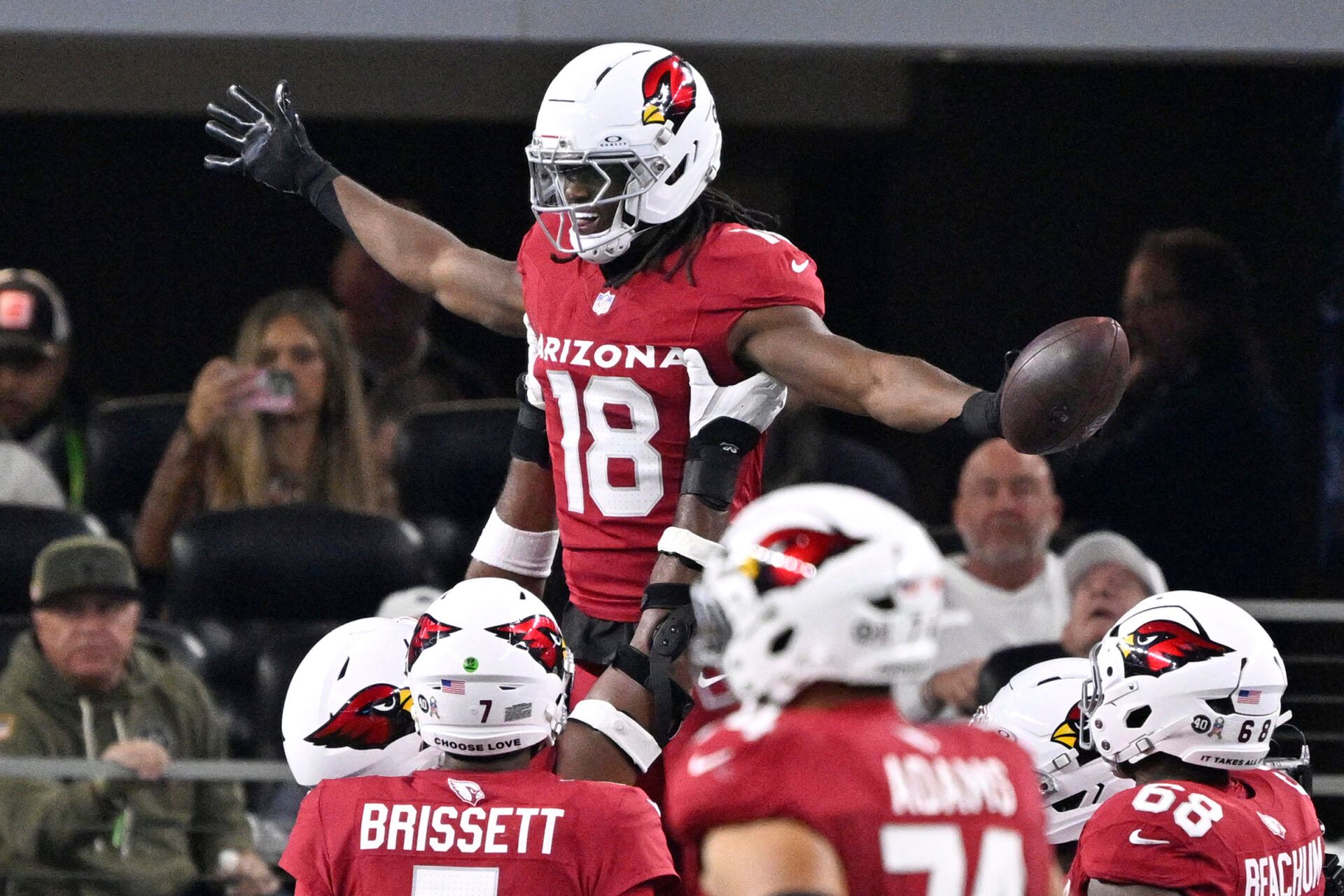 Arizona Cardinals wide receiver Marvin Harrison Jr. (18) celebrates with teammates after scoring a touchdown against the Dallas Cowboys in the first half at AT&T Stadium.