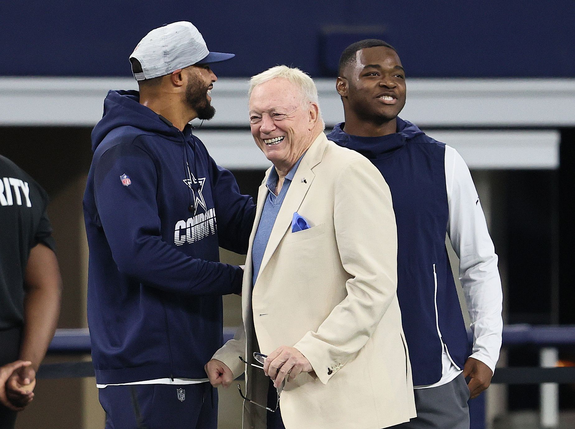 Dallas Cowboys quarterback Dak Prescott , owner Jerry Jones and receiver Amari Cooper talk prior to the game against the Jacksonville Jaguars at AT&T Stadium.
