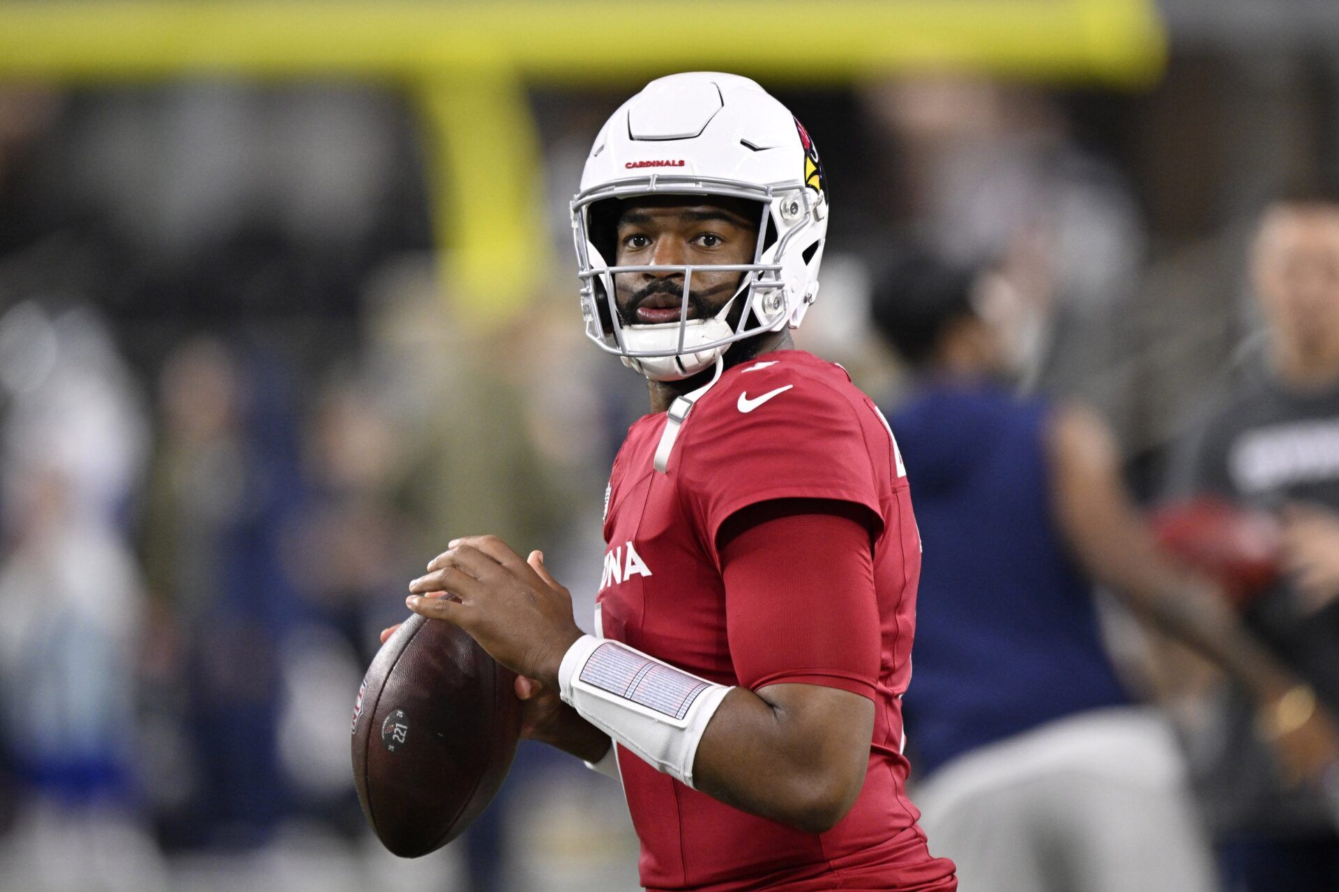 Arizona Cardinals quarterback Jacoby Brissett (7) warms up before the game against the Dallas Cowboys at AT&T Stadium.