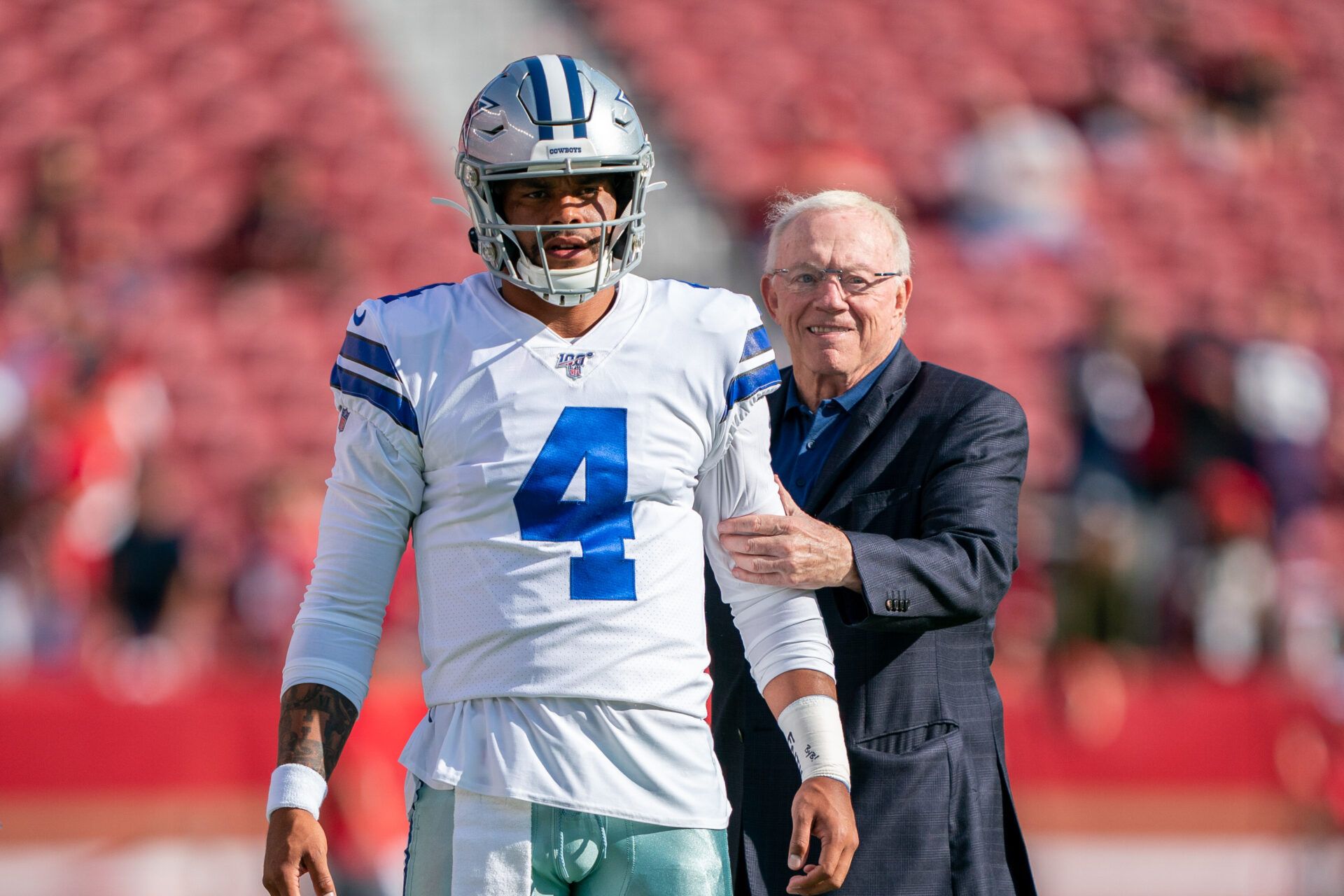 Dallas Cowboys quarterback Dak Prescott (4) and owner Jerry Jones (right) before the game against the San Francisco 49ers at Levi's Stadium.