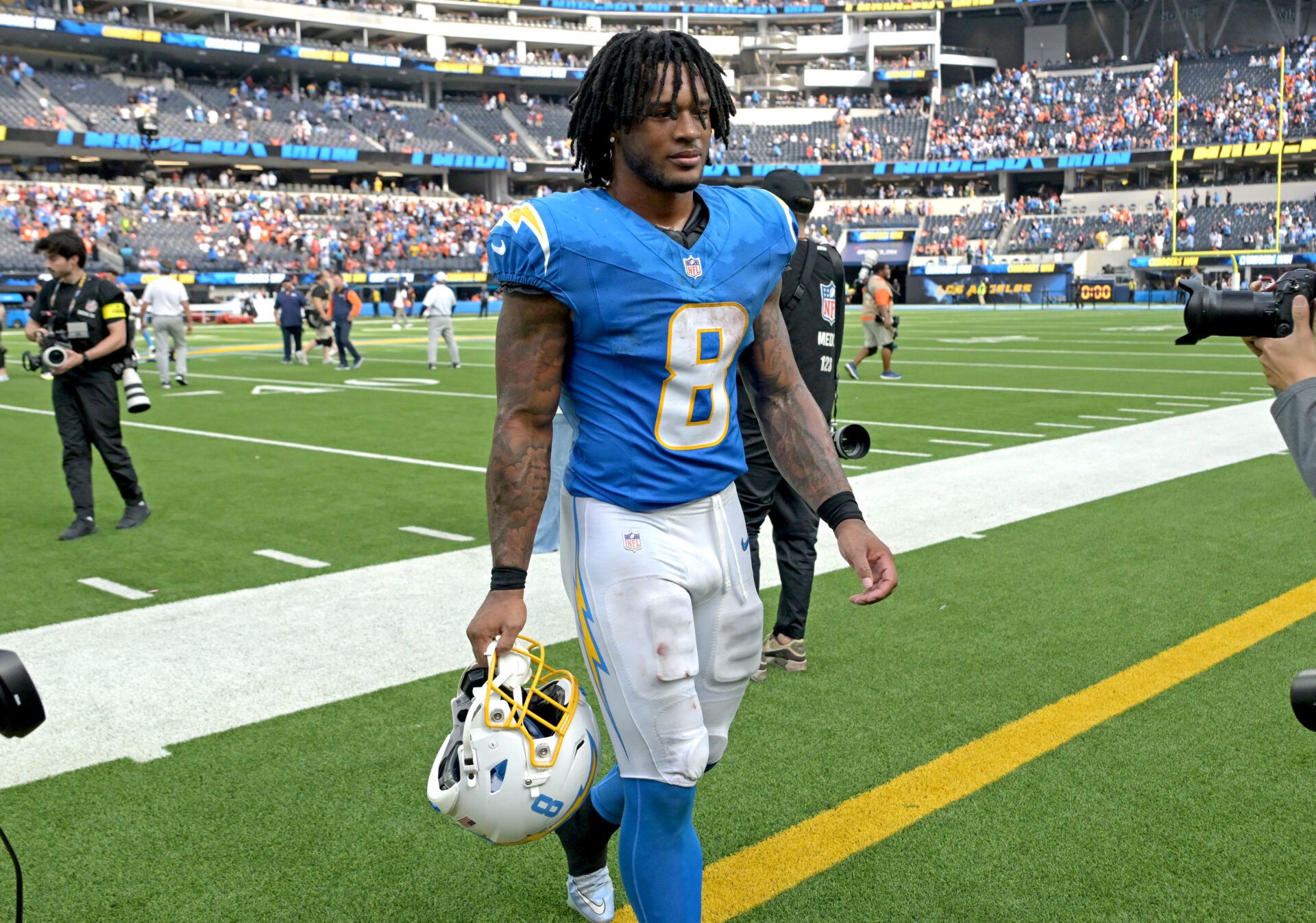 Los Angeles Chargers running back Omarion Hampton (8) leaves the field after defeating the Denver Broncos 23-20 at SoFi Stadium.