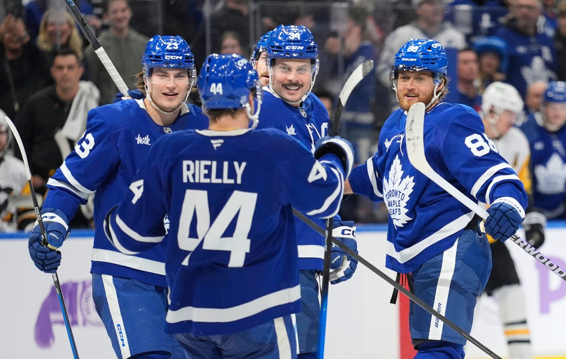 Toronto Maple Leafs defenseman Morgan Rielly (44), forward Matthew Knies (23) and forward Auston Matthews (34) congratulate forward William Nylander (88) after his second goal of the third period against the Pittsburgh Penguins at Scotiabank Arena.