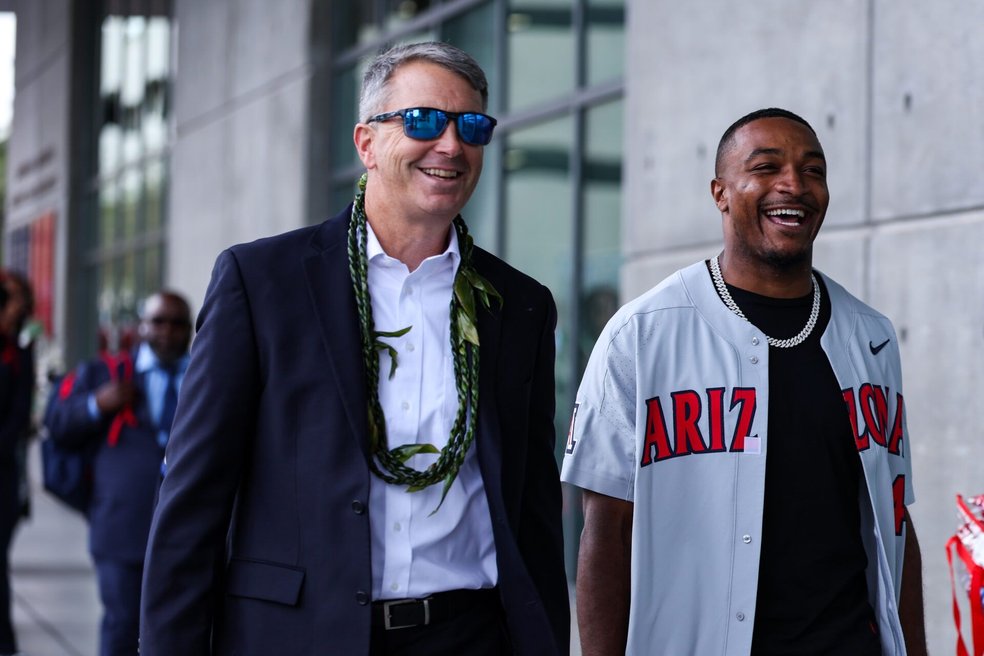 Arizona Wildcats head coach Brent Brennan walks with honorary captain Khalil Tate down the Wildcat Walk before the game against Colorado Buffaloes at Arizona Stadium.