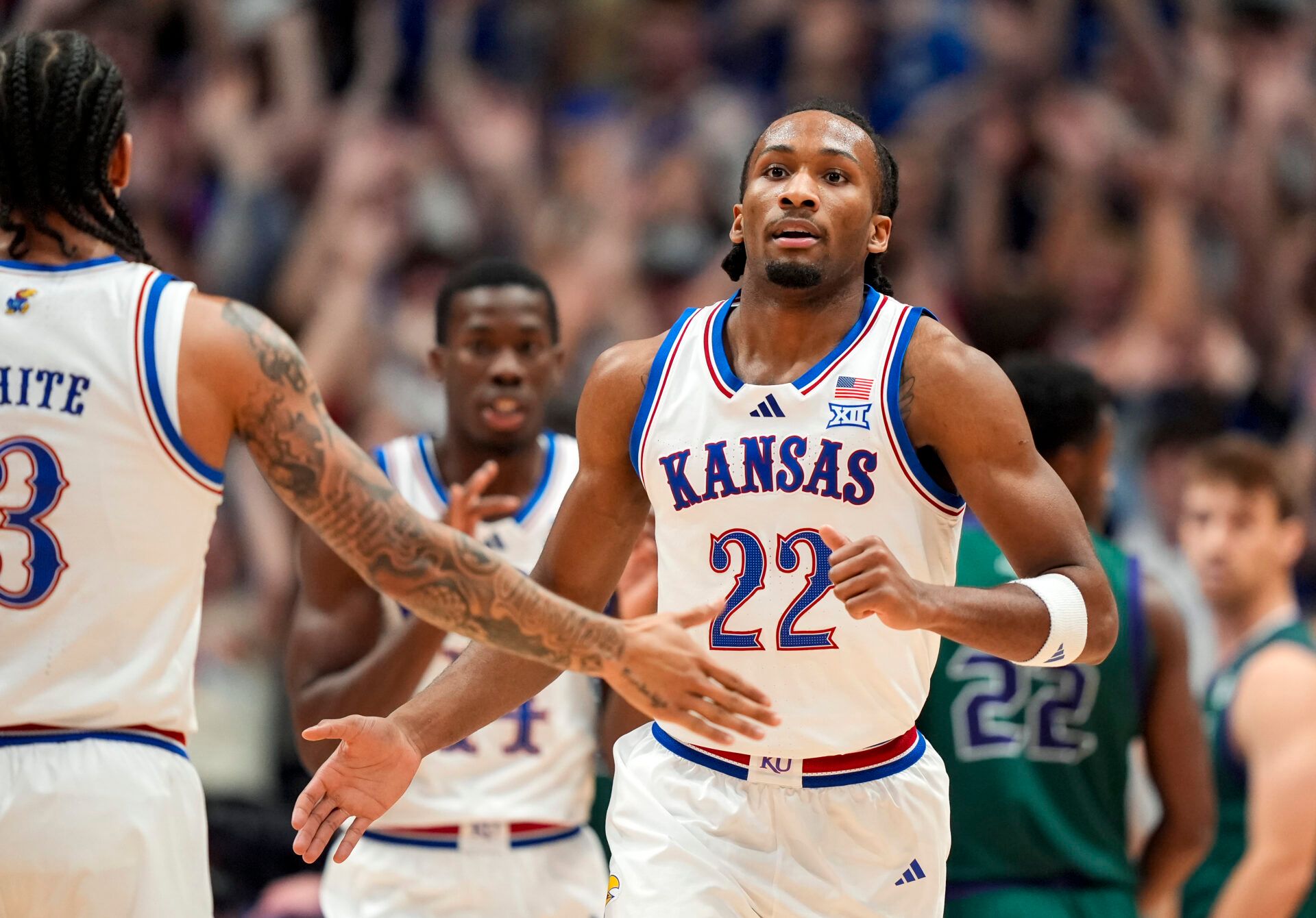 Kansas Jayhawks guard Darryn Peterson (22) reacts after scoring during the first half against the Green Bay Phoenix at Allen Fieldhouse.