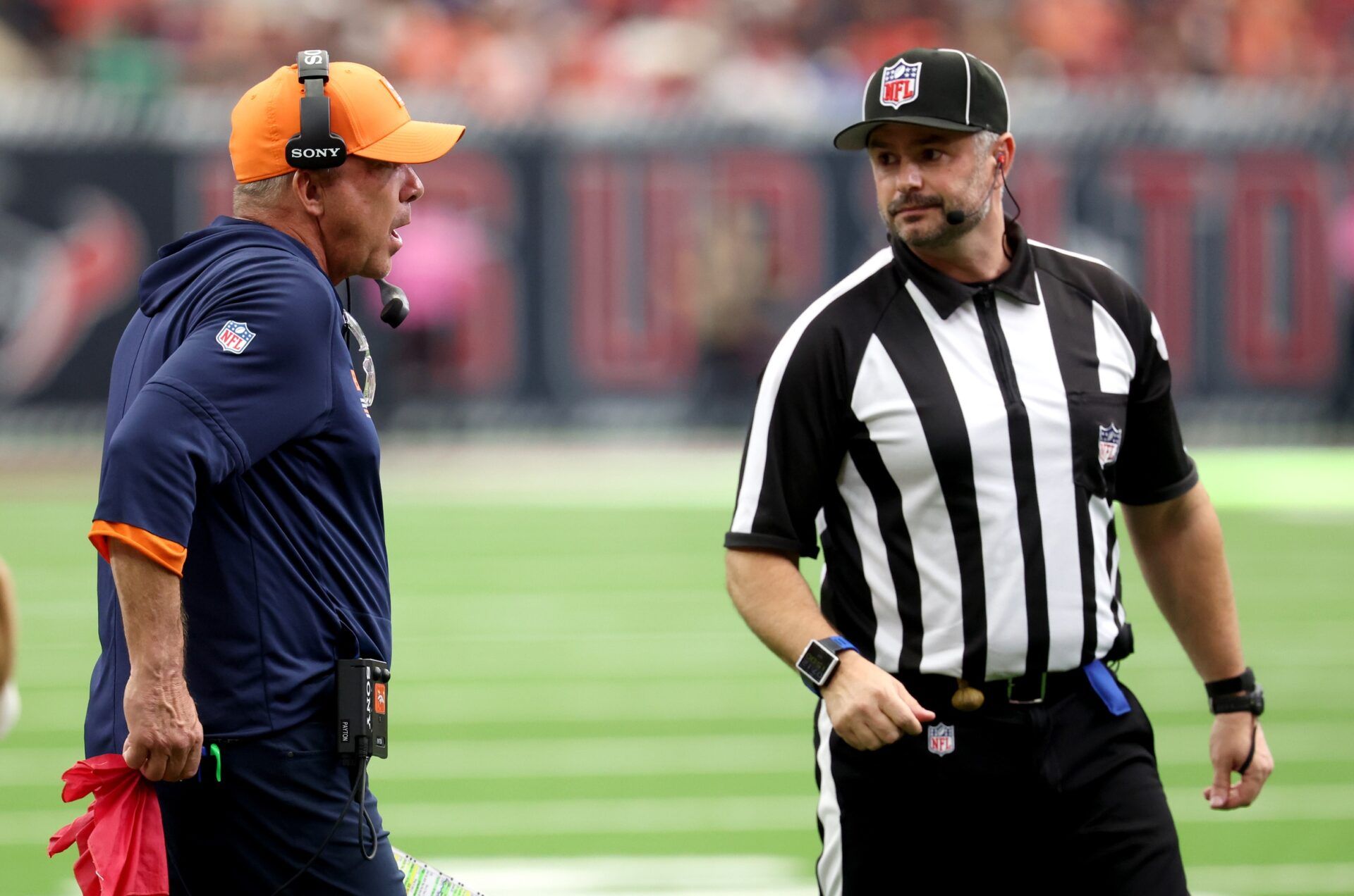 Denver Broncos head coach Sean Payton talks to an official during the second half against the Houston Texans at NRG Stadium.