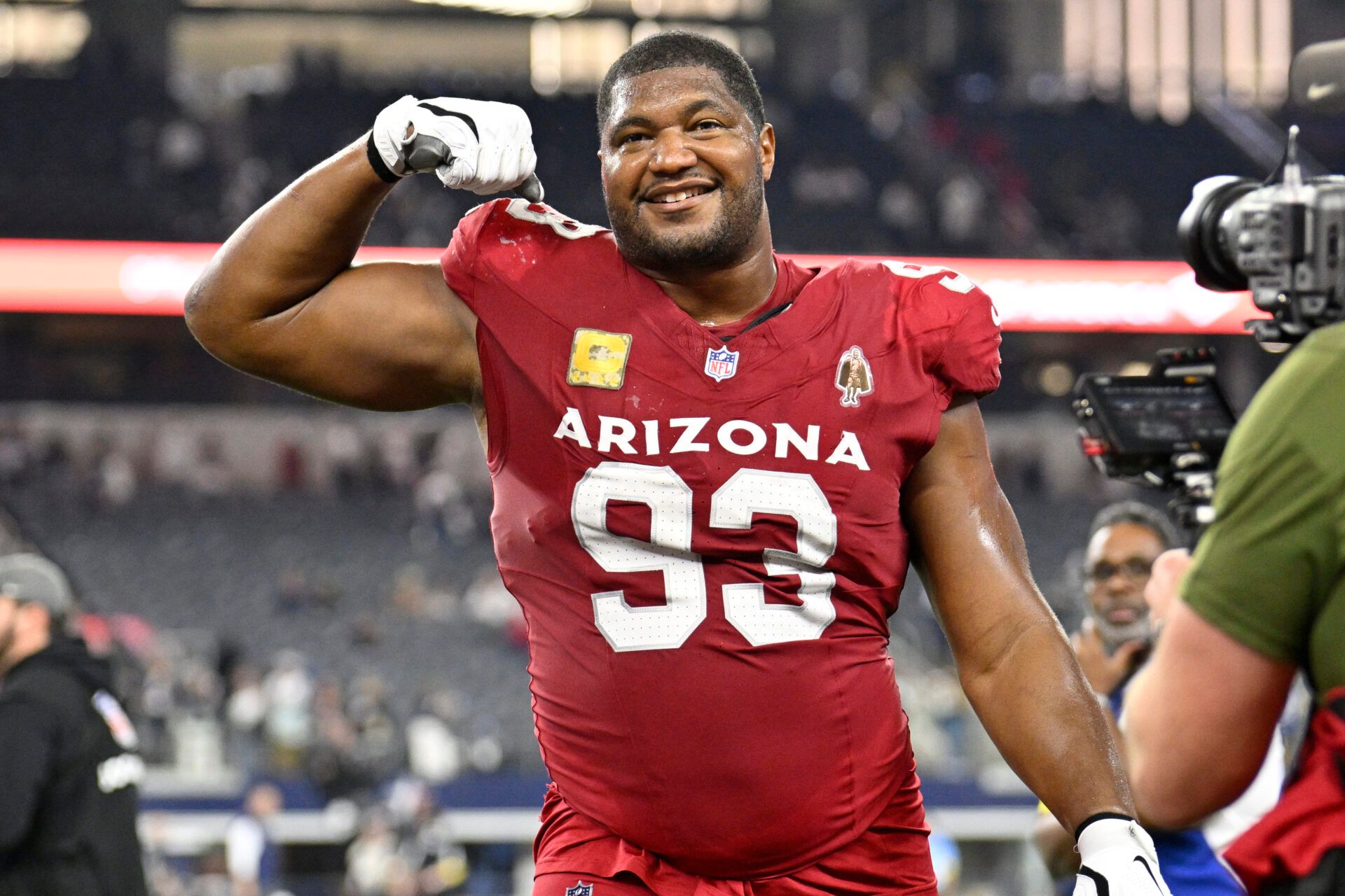 Arizona Cardinals defensive tackle Calais Campbell (93) celebrates as he leaves the field after defeating the Dallas Cowboys at AT&T Stadium.
