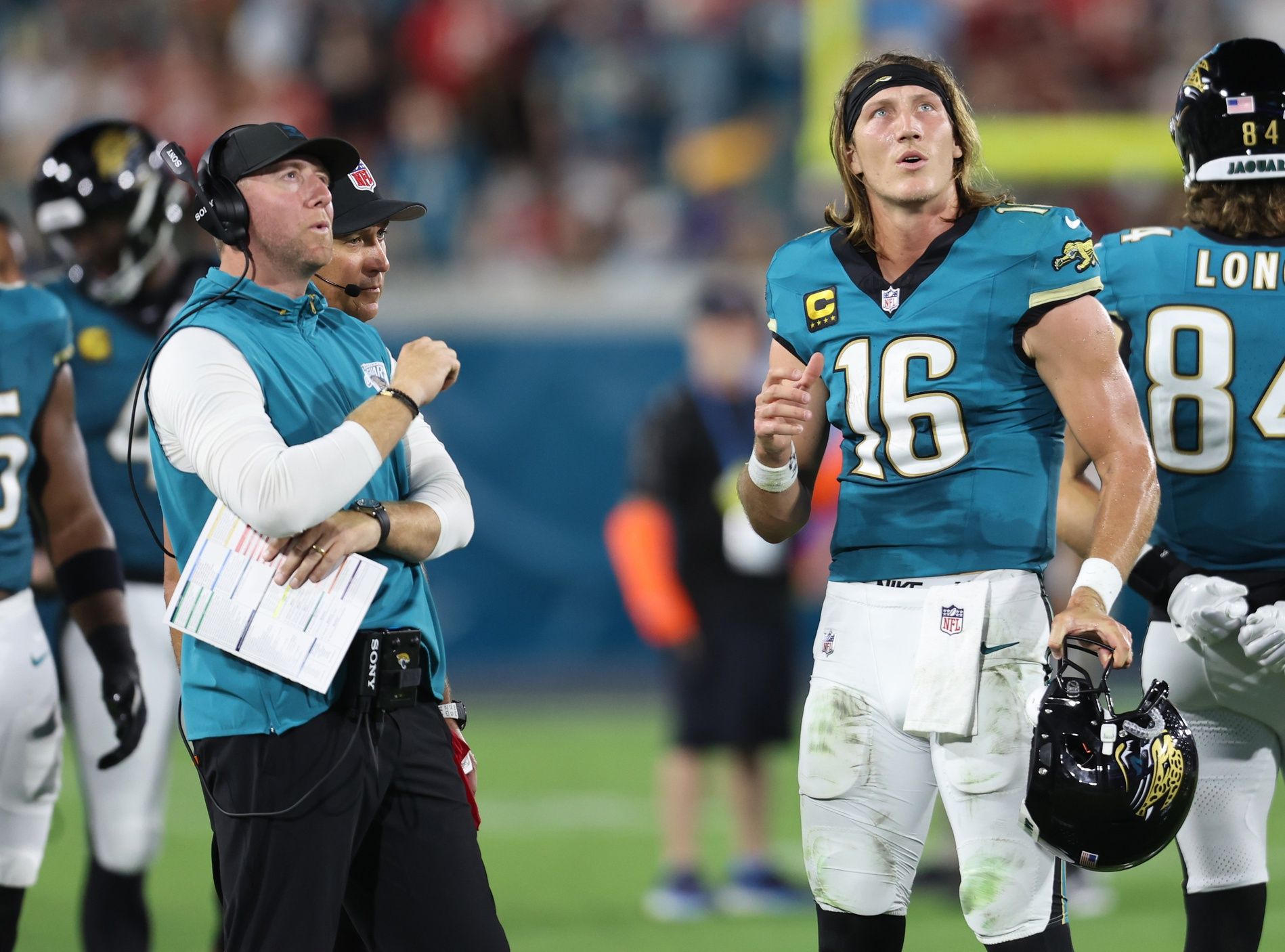 Jacksonville Jaguars head coach Liam Coen and quarterback Trevor Lawrence (16) during the first half against the Kansas City Chiefs at EverBank Stadium.
