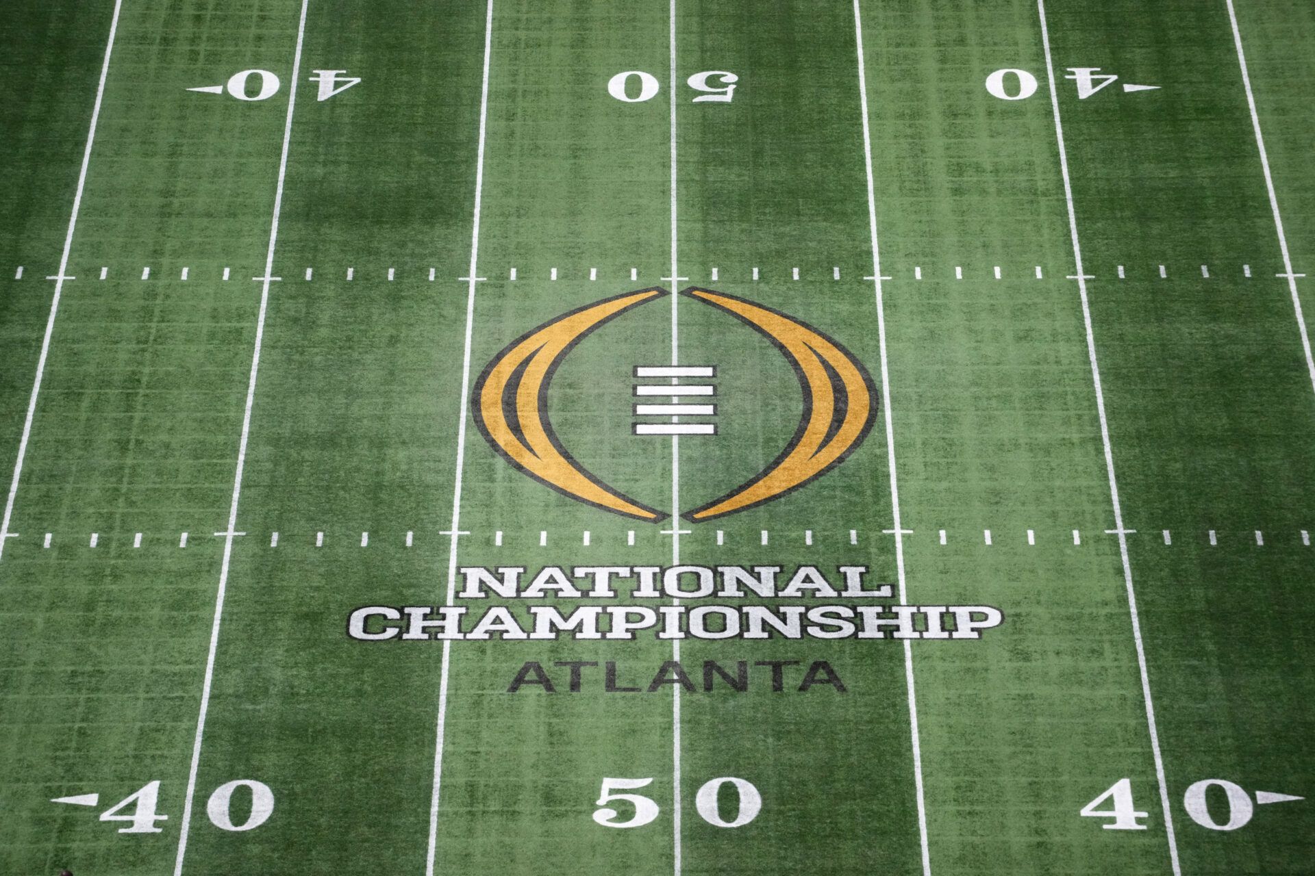 The College Football Playoff National Championship logo at midfield at Mercedes-Benz Stadium, the site of the 2025 College Football Playoff National Championship between the Ohio State Buckeyes and the Notre Dame Fighting Irish.