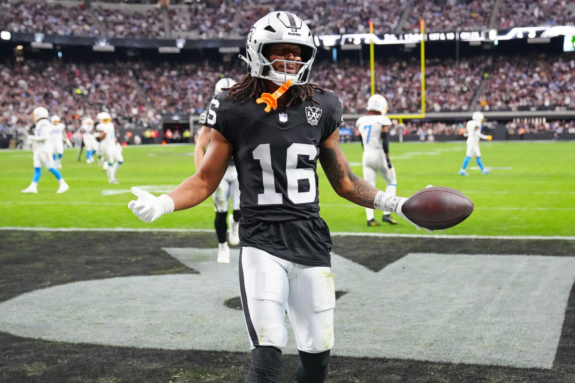 Las Vegas Raiders wide receiver Jakobi Meyers (16) celebrates after scoring a touchdown against the Los Angeles Chargers during the second quarter at Allegiant Stadium.