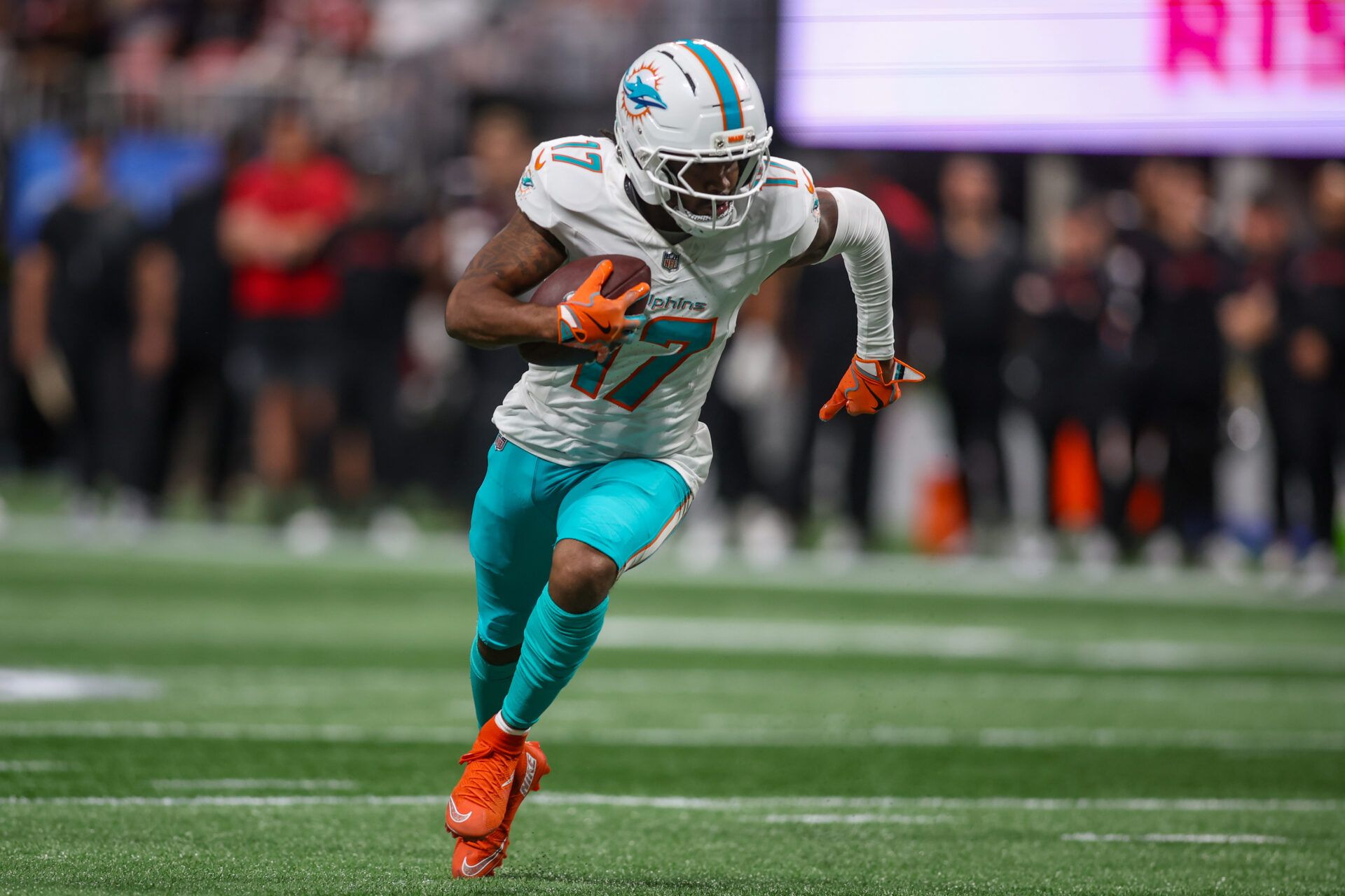 Miami Dolphins wide receiver Jaylen Waddle (17) scores a touchdown against the Atlanta Falcons in the third quarter at Mercedes-Benz Stadium.
