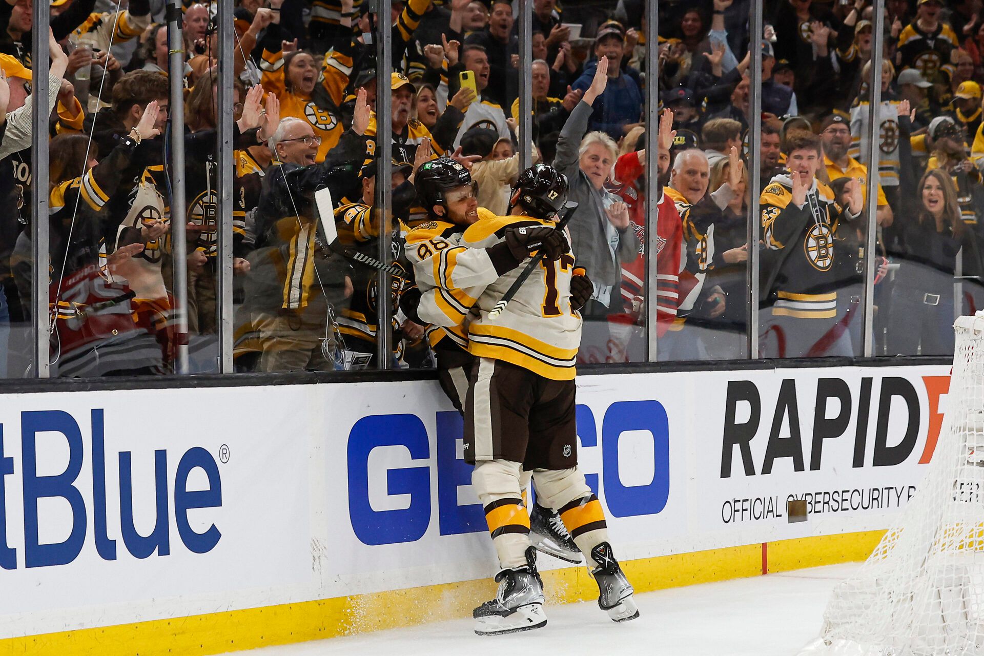Boston Bruins right wing David Pastrnak (88) celebrates his goal with left wing Milan Lucic (17) during the second period against the Chicago Blackhawks at TD Garden.