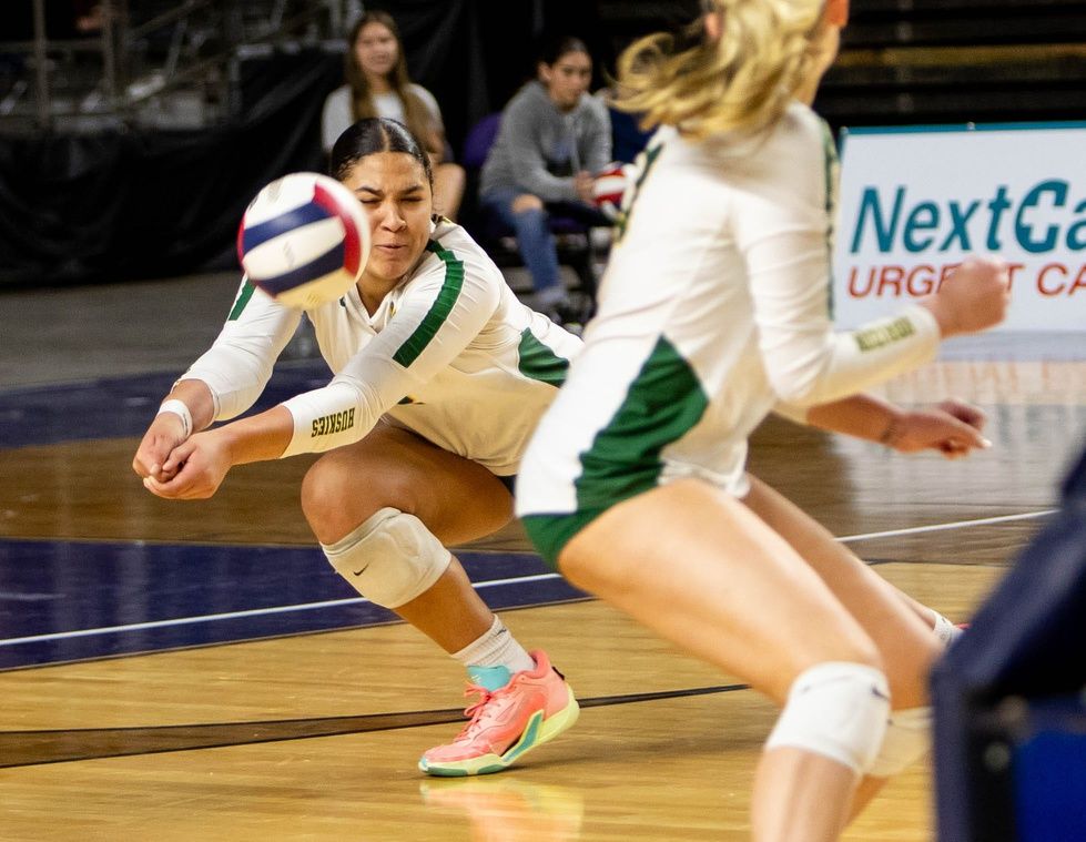 Horizon Huskies outside hitter Teraya Sigler (12) hits the ball against the Millennium Tigers during the 5A state championship game at the Arizona Veterans Memorial Coliseum in Phoenix on Nov. 10, 2023.