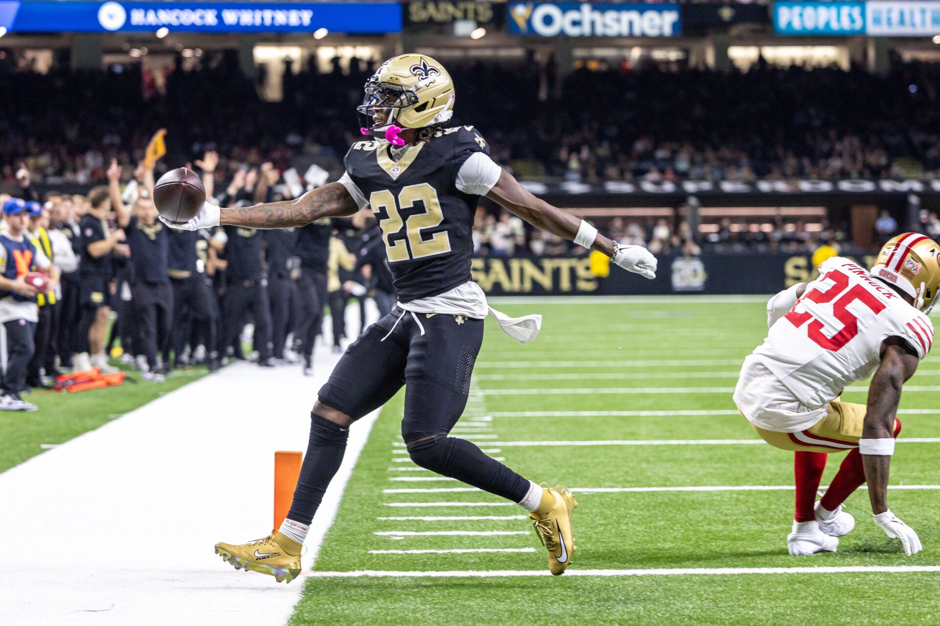 New Orleans Saints wide receiver Rashid Shaheed (22) scores a touchdown against San Francisco 49ers safety Jason Pinnock (25) during the second half at Caesars Superdome.