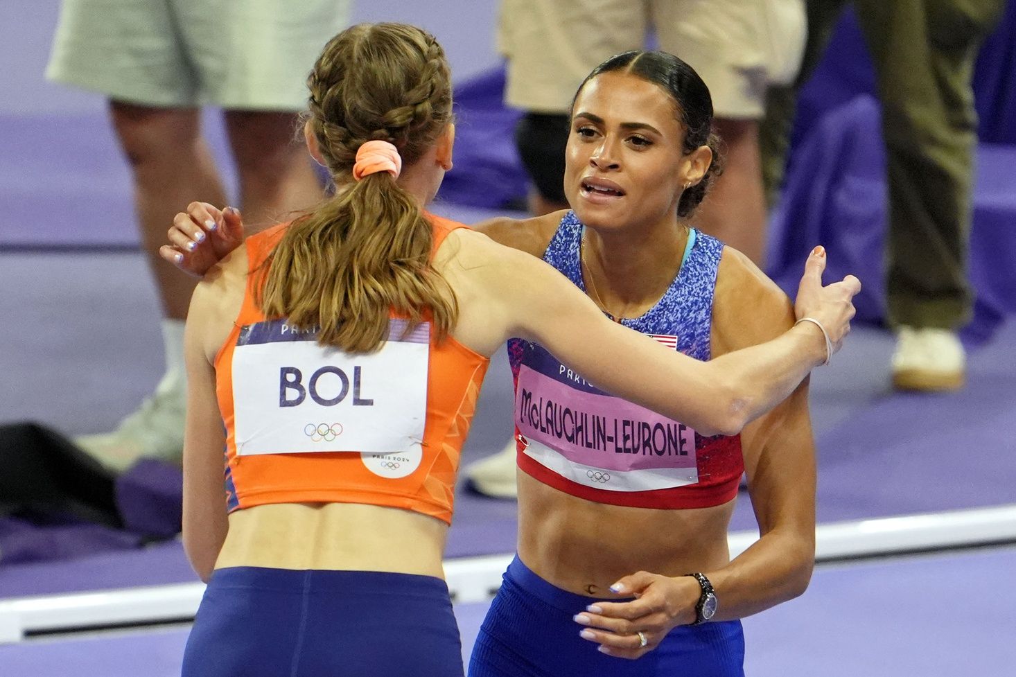 Femke Bol (NED) embraces Sydney McLaughlin-Levrone (USA) after they won bronze and gold in the womens 400m hurdle final during the Paris 2024 Olympic Summer Games at Stade de France.