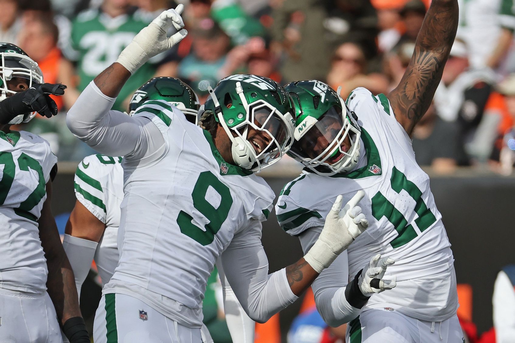 New York Jets defensive end Will McDonald IV (9) and linebacker Jermaine Johnson (11) /celebrates during the fourth quarter against the Cincinnati Bengals at Paycor Stadium.