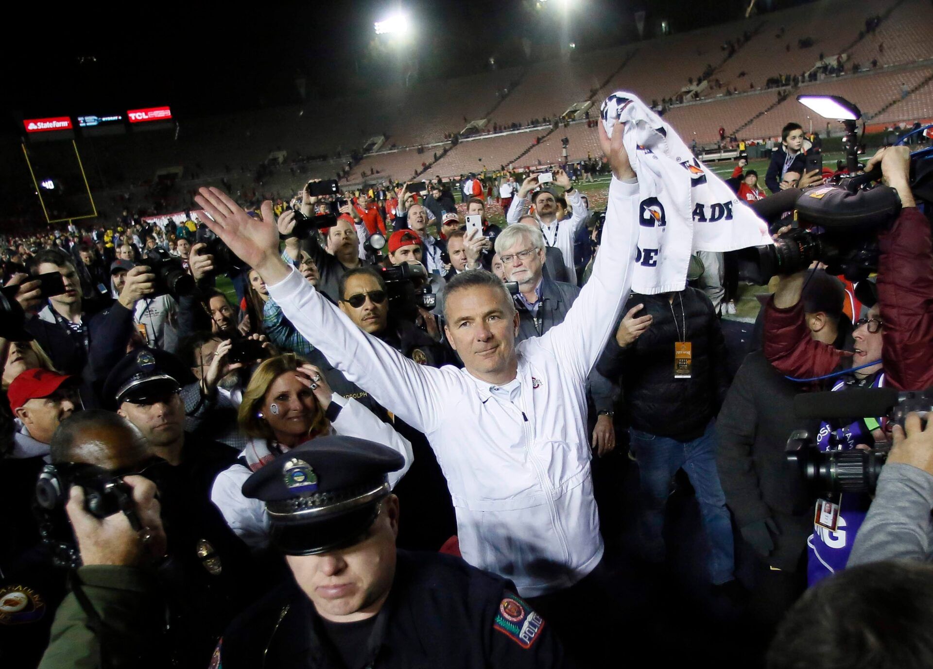 In his final game as the Ohio State Buckeyes head coach, Urban Meyer salutes the fans as he leaves the field following the 28-23 win over the Washington Huskies in the Rose Bowl in Pasadena, Calif. on Jan. 1, 2019. [Adam Cairns/Dispatch]