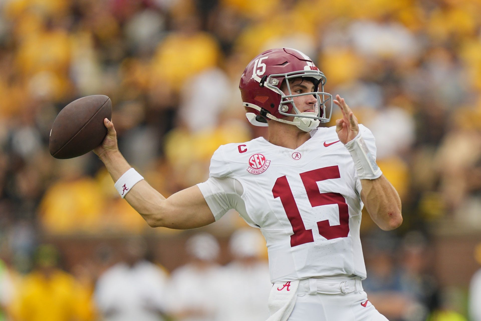 Alabama Crimson Tide quarterback Ty Simpson (15) throws against the Missouri Tigers during the first half of the game at Faurot Field at Memorial Stadium.
