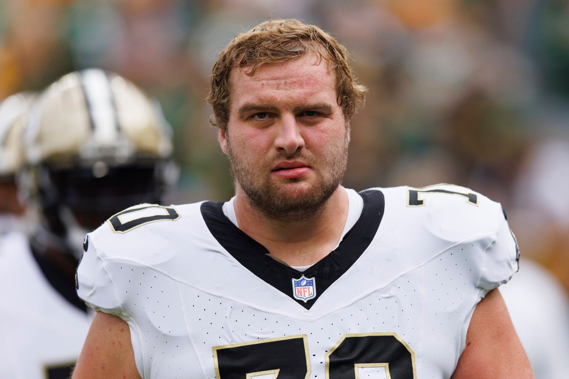 New Orleans Saints offensive tackle Trevor Penning (70) during warmups prior to the game against the Green Bay Packers at Lambeau Field.