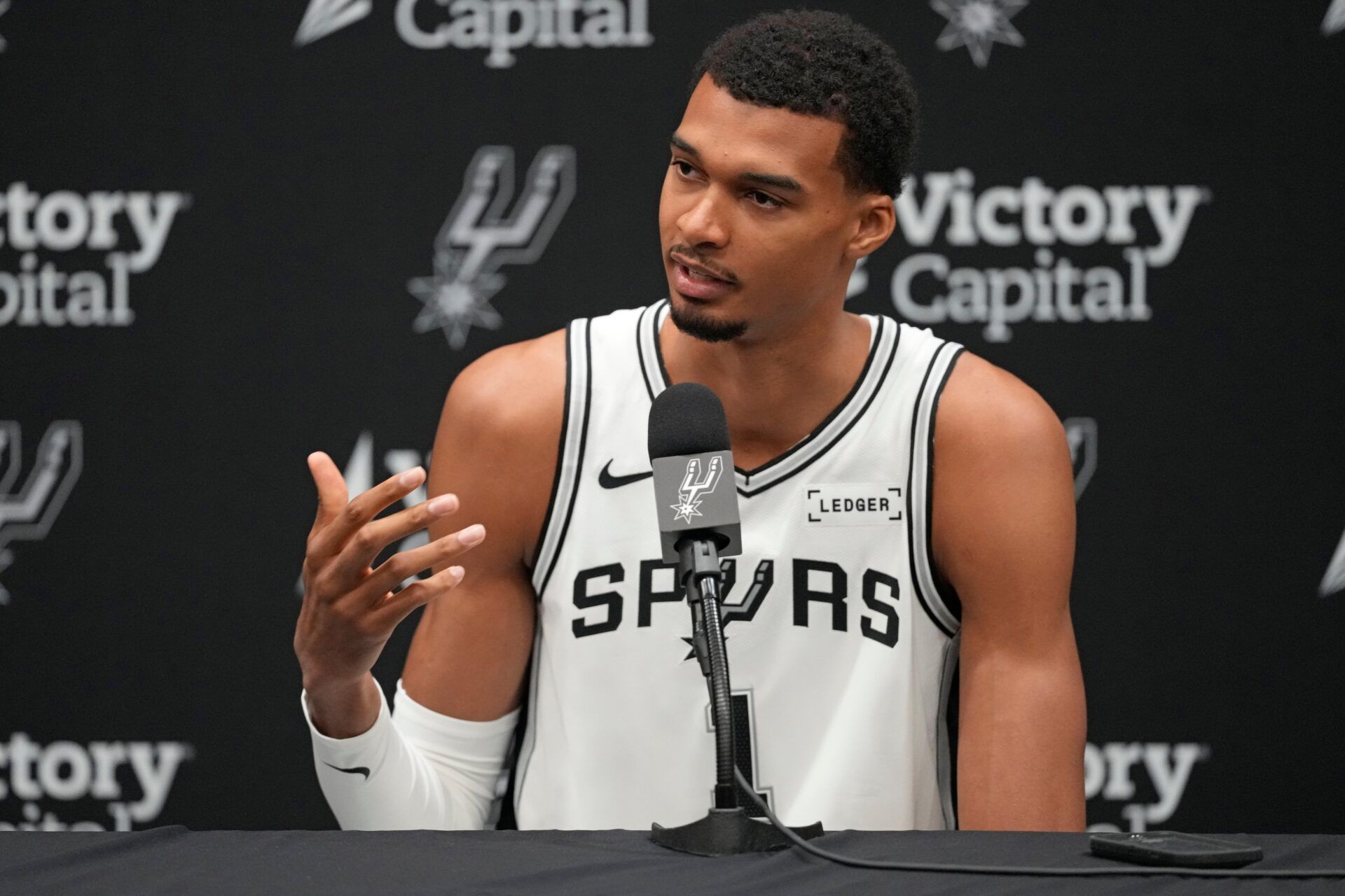 San Antonio Spurs forward-center Victor Wembanyama (1) answers questions from the media during Media Day at Victory Capital Performance Center in San Antonio.