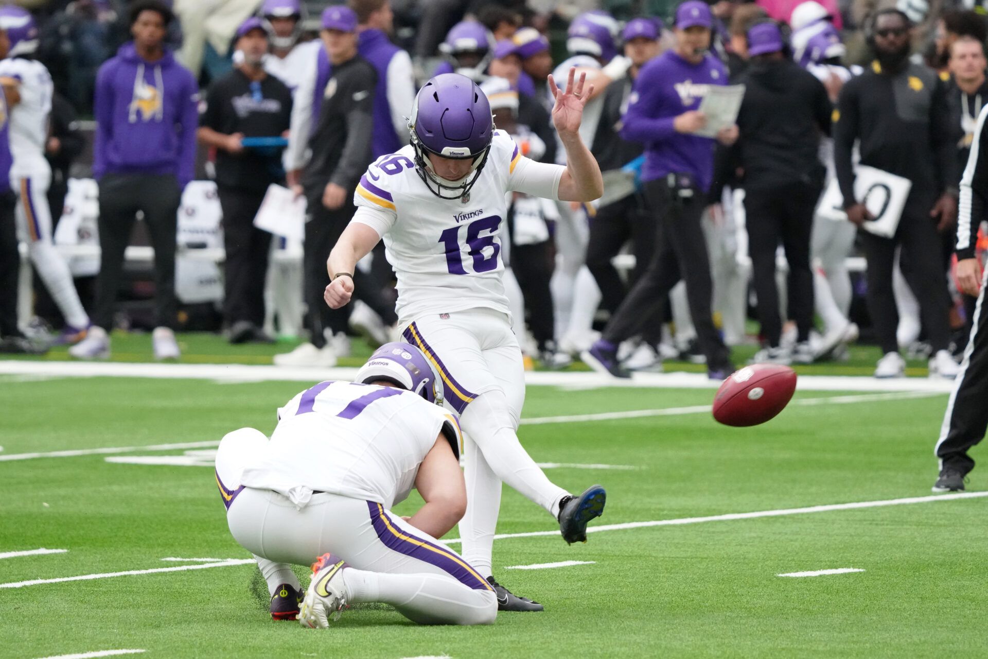 Minnesota Vikings kicker Will Reichard (16) kicks a point after attempt against the Cleveland Browns during the third quarter of an NFL International Series game at Tottenham Hotspur Stadium.
