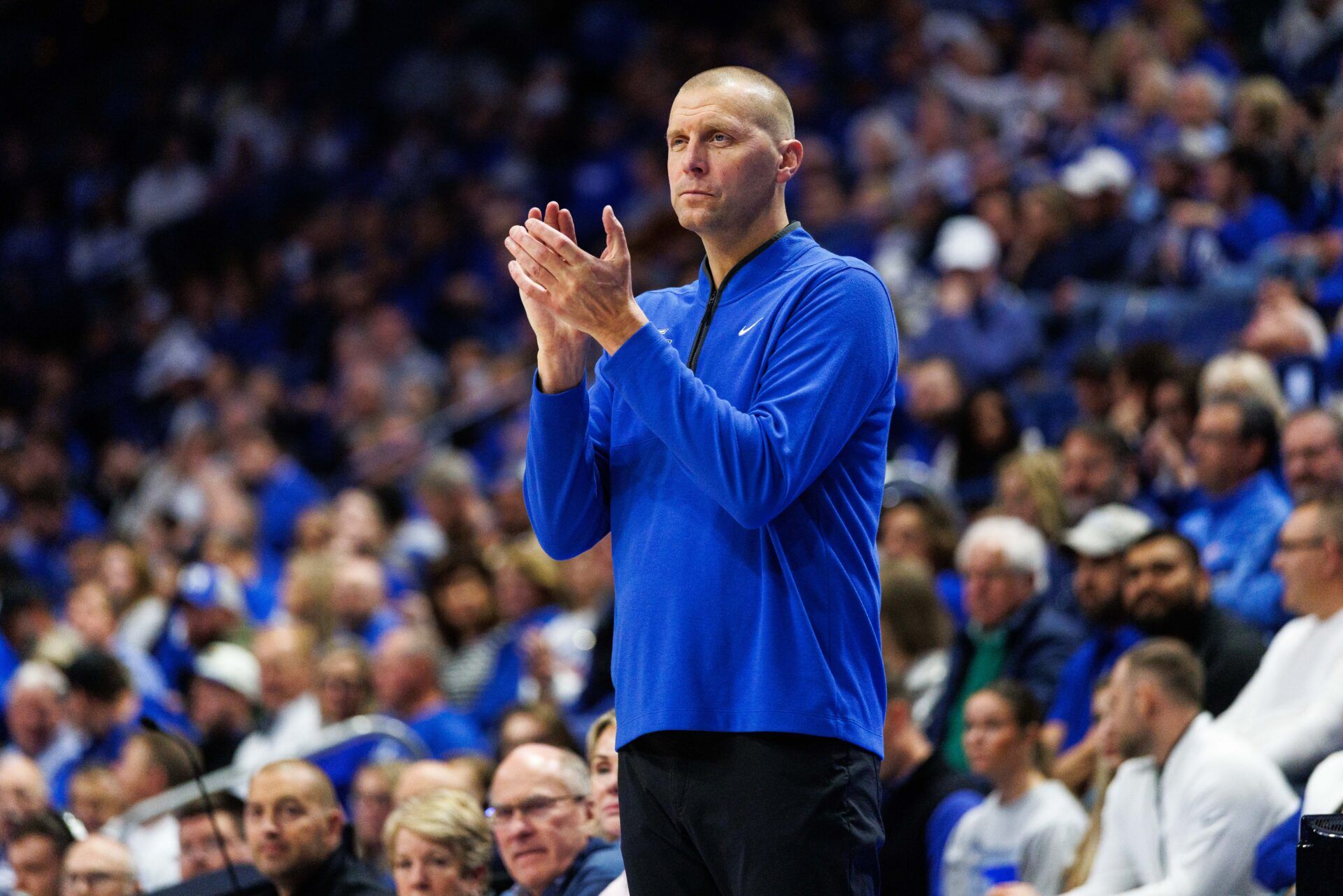 Kentucky Wildcats head coach Mark Pope claps as he watches the action during the first half against the Georgetown Hoyas at Rupp Arena at Central Bank Center.
