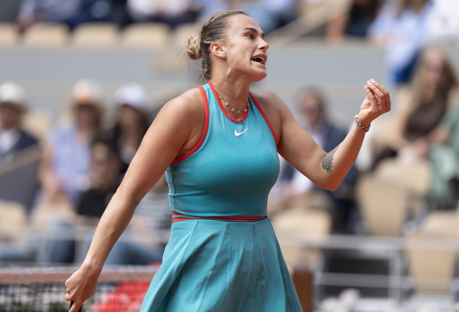 Aryna Sabalenka reacts to a point during her match against Qinwen Zheng  of China on day 10 at Roland Garros Stadium.