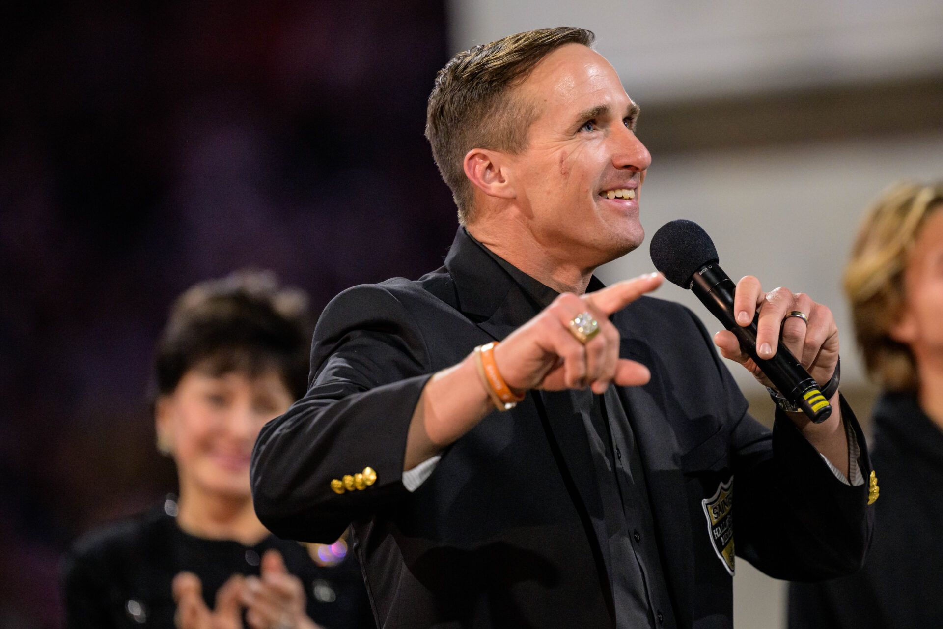 New Orleans Saints retired quarterback Drew Brees (9) reacts during his hall of fame ceremony at halftime against the Denver Broncos at Caesars Superdome.