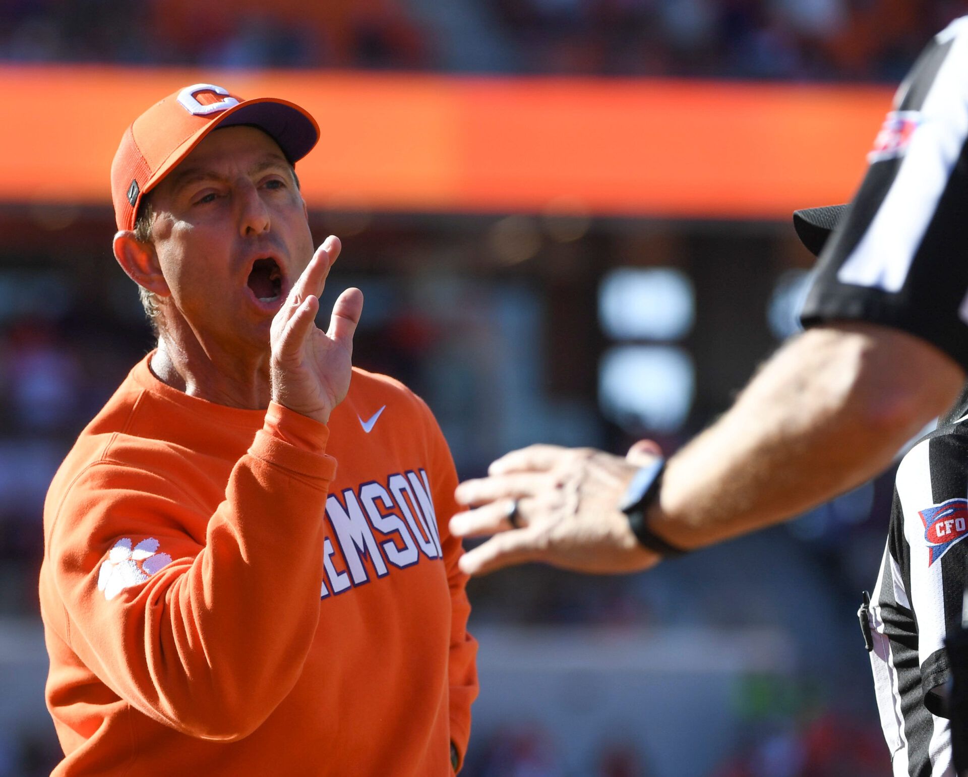 Clemson Tigers head coach Dabo Swinney talks to an official during the NCAA football game against the Duke Blue Devils  during the game at Memorial Stadium.